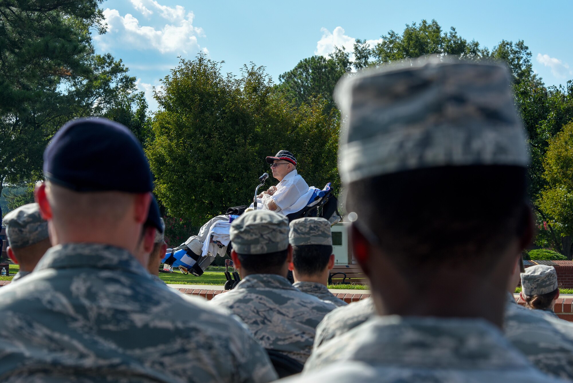 Members of Team Seymour listen as Gaspar Gonzalez, a former Korean War Prisoner of War and U.S. Army Green Beret, speaks during a Prisoners of War/Missing in Action Remembrance Ceremony, Sept. 15, 2016, at Seymour Johnson Air Force Base, North Carolina. Gonzalez spoke about his time as a POW and asked those in attendance to take care of those who’d come back and the families of those still missing. (U.S. Air Force photo by Airman Shawna L. Keyes)