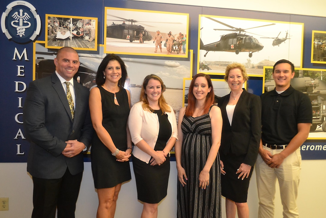 The DLA Troop Support Medical supply chain’s “dream team”: from left to right, Alexander Quinones, integrated supply team chief; Denise Taubman, Amanda Doherty, and Danielle Delaney, contracting officers; Joanne Marie Grace, acquisition specialist; and Christopher Newman, intern.