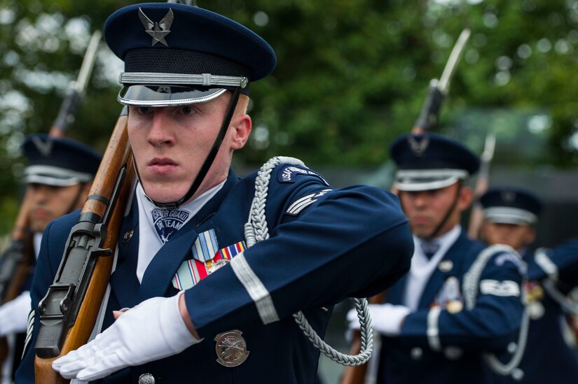 Staff Sgt. Alexander Wilson, U.S. Air Force Honor Guard Drill Team member, performs a routine during the POW/MIA and Air Force Birthday event at the Air Force Memorial in Arlington, Va., Sept. 16, 2016. The 69th Air Force Birthday celebration began with a drill team performance, including a narrator describing the techniques performed. 