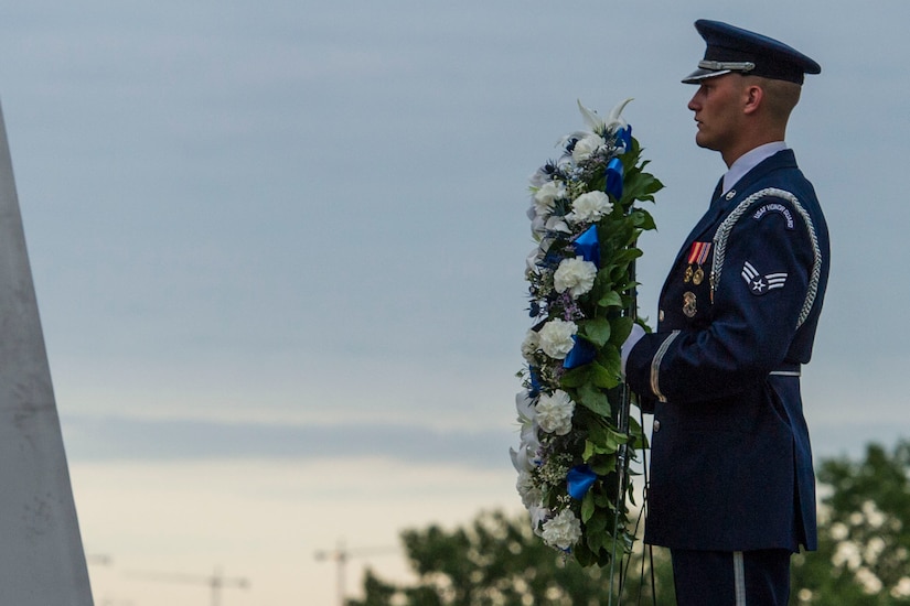 A U.S. Air Force Honor Guard Drill Team member prepares to lay a POW/MIA wreath during the POW/MIA and Air Force Birthday event at the Air Force Memorial in Arlington, Va., Sept. 16, 2016. The wreath was handed to Gen. David L. Goldfein, Chief of Staff of the Air Force, and Deborah Lee James, Secretary of the Air Force, prior to a moment of silence to pay respects to POW/MIAs. 
