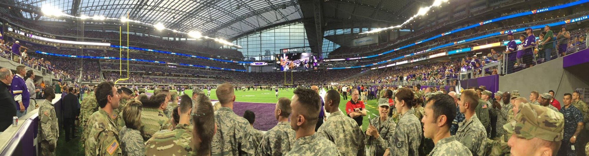 Minnesota military members prepare to unfurl the American Flag during the pregame ceremonies at the inaugural Minnesota Vikings game at U.S. Bank Stadium Sept. 18.  