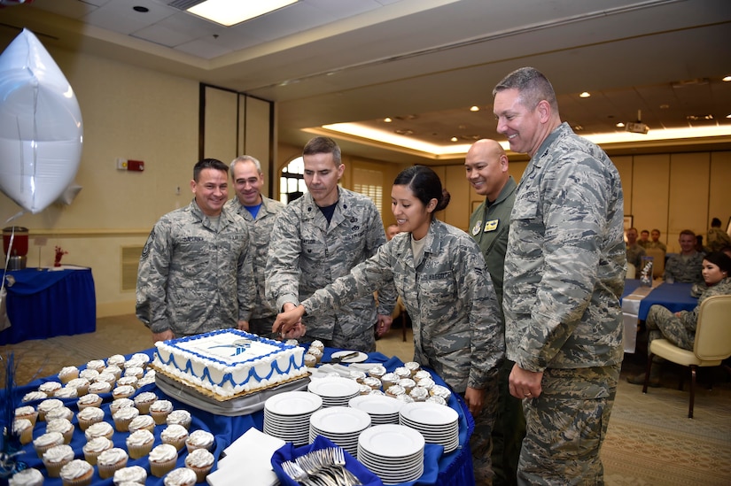 Lt. Col. Ralph Taylor, 628th Mission Support Group deputy commander, and Airman 1st Class Gloria Rembao, 628th Force Support Squadron food apprentice, perform the ceremonial cake cutting to celebrate the Air Force’s 69th birthday at the Charleston Club, Sept. 16, 2016. The U.S. Army Air Forces became the Department of the Air Force after the National Security Act of 1947 was signed. W. Stuart Symington, the first Secretary of the Air Force, was sworn into office Sept. 18, 1947.