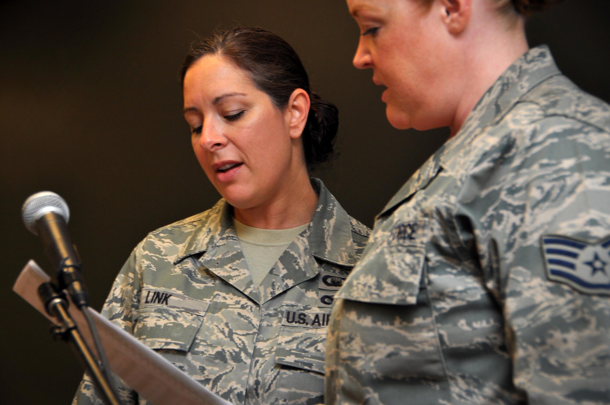 Staff Sgt. Jamie Link, 94th Airlift Wing Chapel Corps chaplain’s assistant, sings hymns during worship service at Dobbins Air Reserve Base, August 7, 2016. Staff Sgt. Lindsey Black, 94th AW broadcast journalist, lends her voice to praise during services as well. (U.S. Air Force photo by Senior Airman Lauren Douglas)