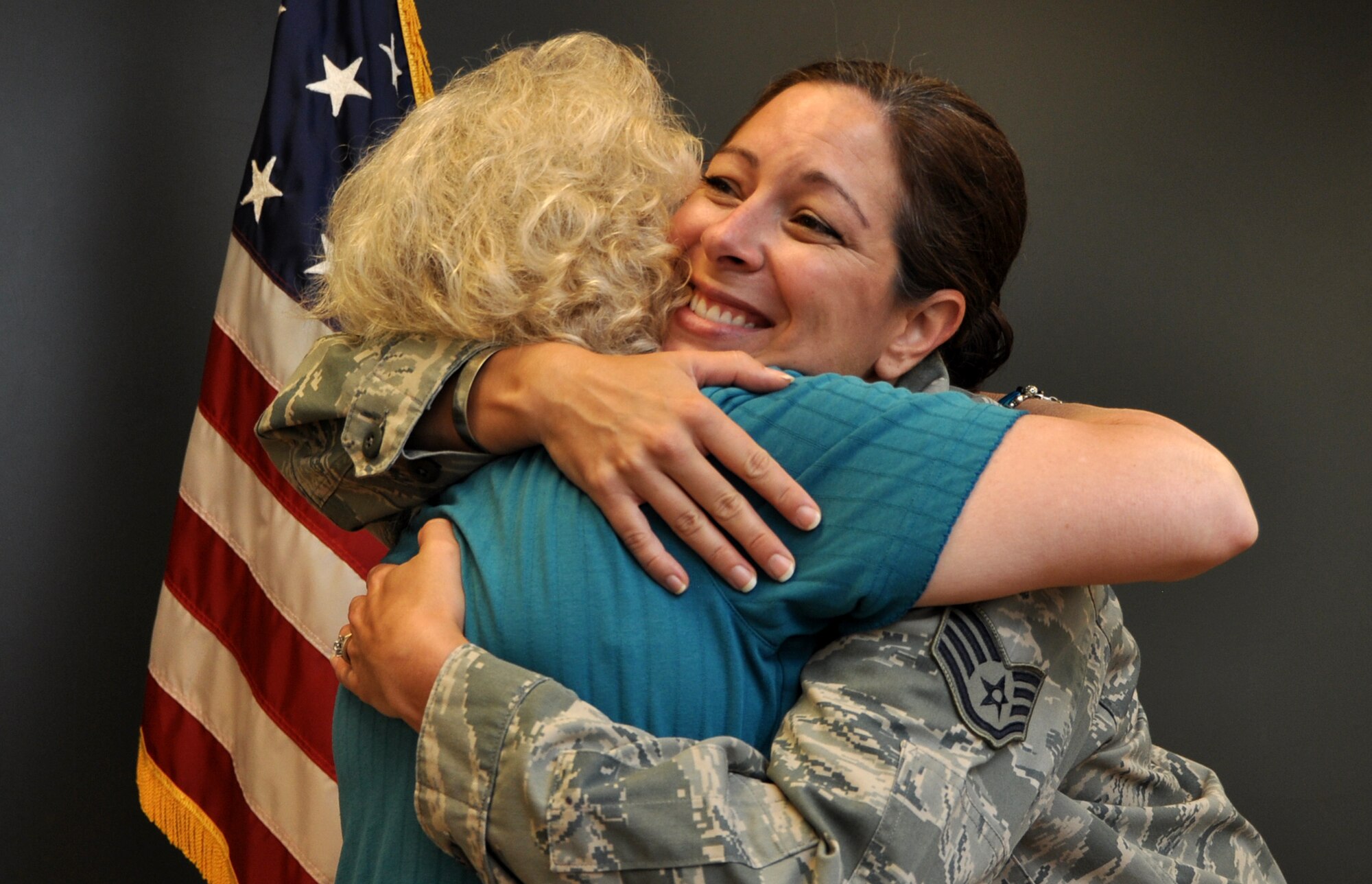 Staff Sgt. Jamie Link, 94th Airlift Wing Chapel Corps chaplain’s assistant, embraces Carol Pope, volunteer worship leader, at Dobbins Air Reserve Base, August 7, 2016. Pope comes to play piano, sing, and assist with the spiritual service for troops on base during the unit training assembly. Pope is sad to see Link depart from Dobbins service. (U.S. Air Force photo by Senior Airman Lauren Douglas)