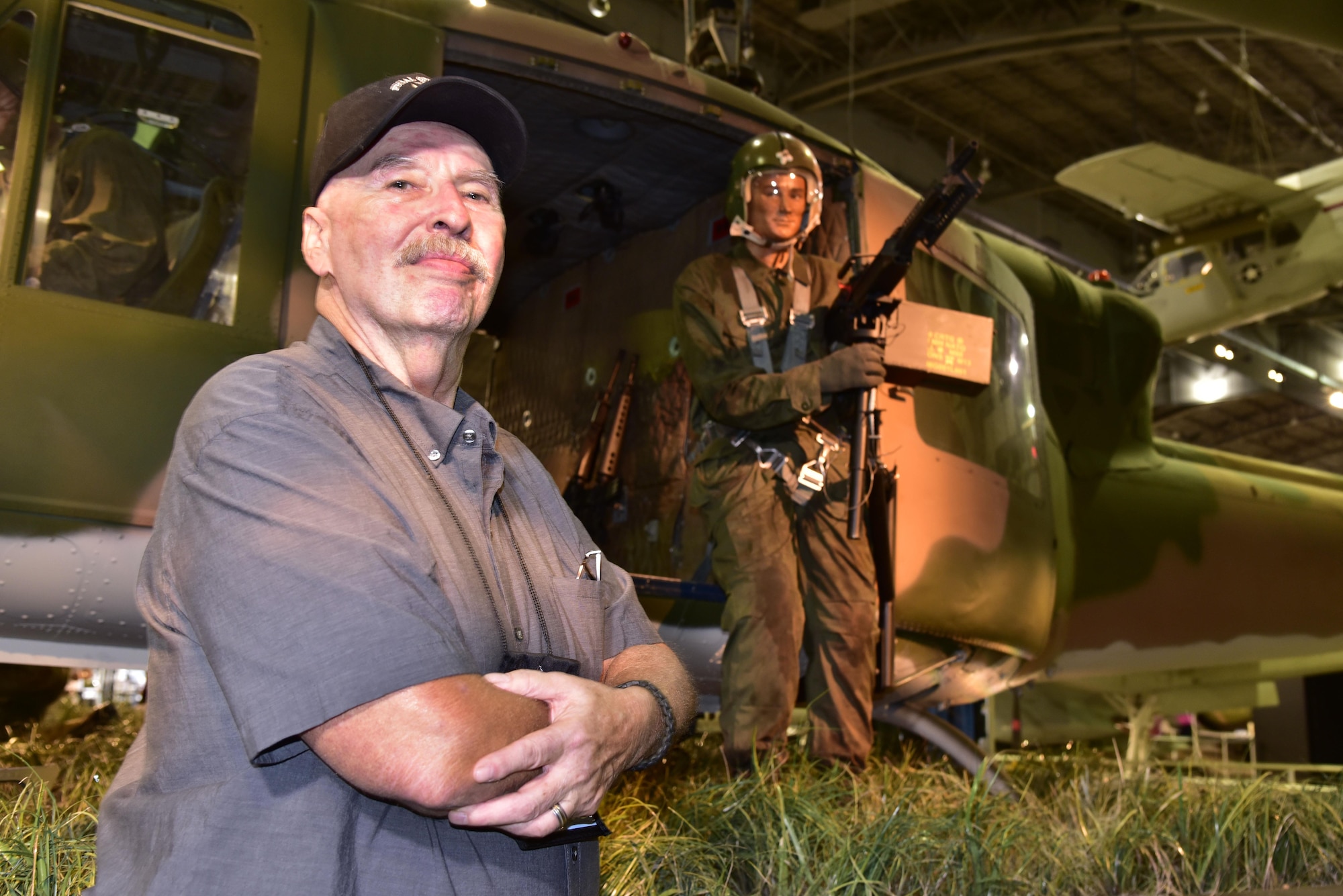 DAYTON, Ohio -- SSgt. Paul Jensen stands in front of the Secret War diorama in the Southeast Asia War Gallery at the National Museum of the U.S. Air Force on Sept. 15, 2016. From 1967 to 1971, he served in the U.S. Air Force with duties as Helicopter Tech/door gunner. Served combat tours in Vietnam from 1968 to 1969 and 1970-1971with the 20th SOS “Green Hornets” as a Sgt. (E-4) Flight Mechanic/Gunner on UH-1F/P “slicks.” Jensen was the left door gunner on the 26 Nov 1968 mission that is depicted in the National Museum of the U.S. Air Force’s UH-1P, 20th SOS “Green Hornets,” legacy diorama display. He was awarded the Distinguished Flying Cross for Valor for his part in this mission.U.S. Air Force photo by Ken LaRock)
