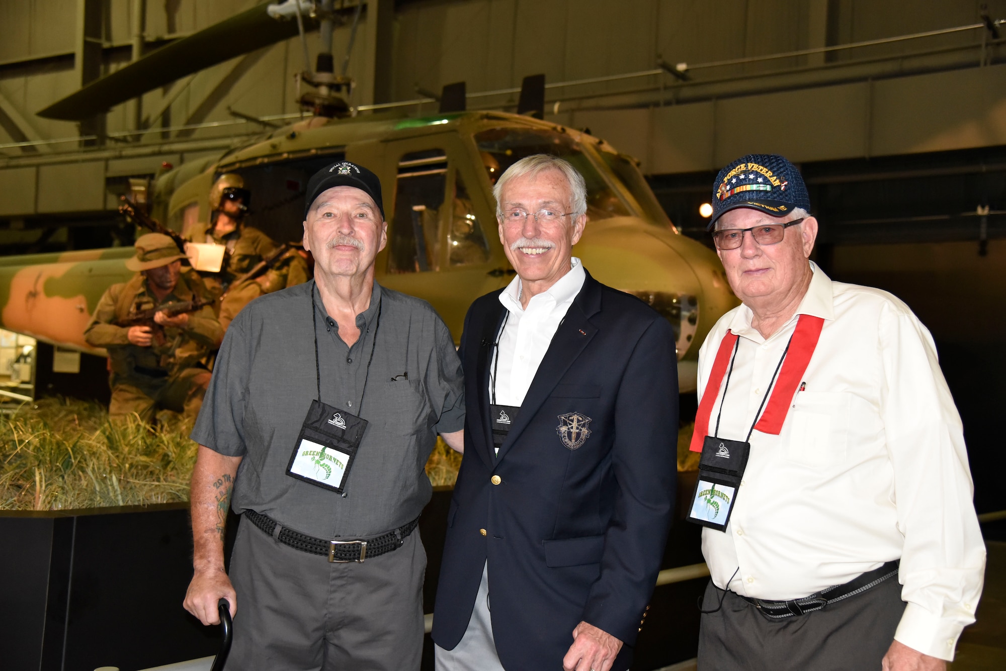 DAYTON, Ohio -- (From left to right) SSgt. Paul Jensen, Capt. Randy Harrison, MSgt.(Ret.) Fred Cook stand in front of the Secret War diorama in the Southeast Asia War Gallery at the National Museum of the U.S. Air Force on Sept. 15, 2016. These veterans took part in the 26 Nov 1968 mission that is depicted in the National Museum of the U.S. Air Force’s UH-1P, 20th SOS “Green Hornets,” legacy diorama display. (U.S. Air Force photo by Ken LaRock)

