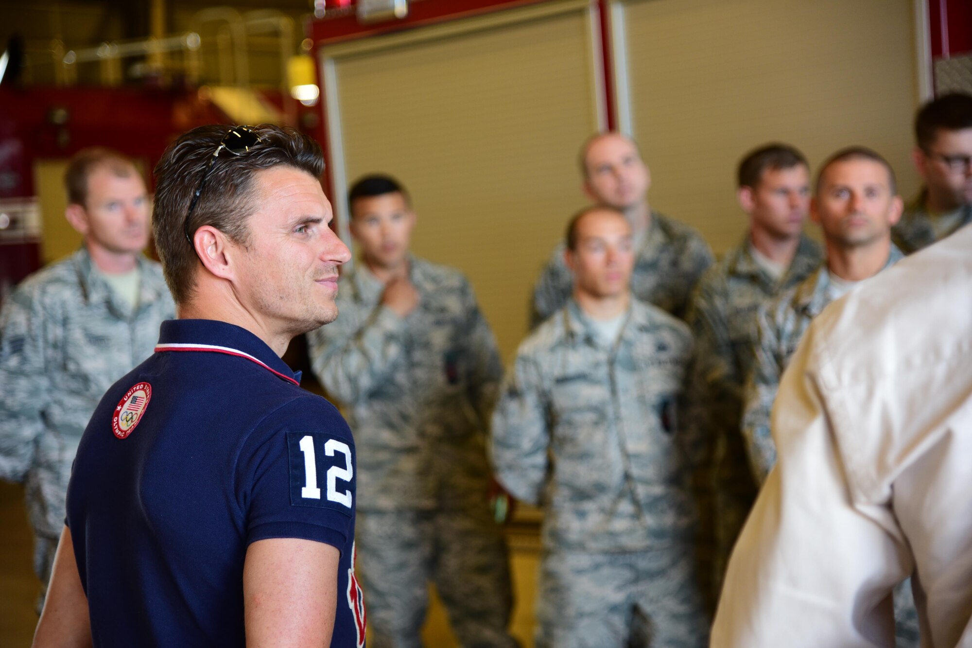 PETERSON AIR FORCE BASE, Colo. - Troy Dumais, four-time U.S. Olympic diver, visits the base fire station with a member from the American300 group as part of the tour launching their new program “Dive into Service” at Peterson Air Force Base, Colo., Sept. 12, 2016. Dive into Service is a mentor and relationship-building program that partners service members with U.S. Dive Team athletes to share like experiences as representatives of the United States. (U.S. Air Force photo by Staff Sgt. Amber Grimm)