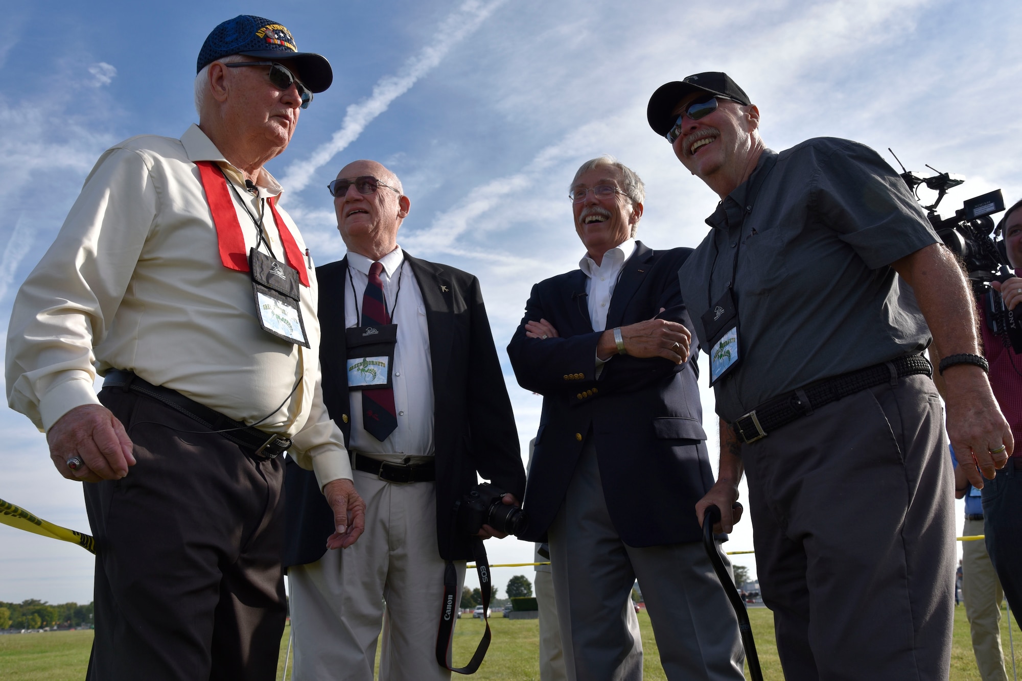 DAYTON, Ohio -- (From left to right) MSgt.(Ret.) Fred Cook, William Huber, Capt. Randy Harrison and SSgt. Paul Jensen await a CV-22 Osprey fly over before the Green Hornet Dedication ceremony at the National Museum of the United States Air Force, Sept. 15, 2016. These veterans took part in the 26 Nov 1968 mission that is depicted in the National Museum of the U.S. Air Force’s UH-1P, 20th SOS “Green Hornets,” legacy diorama display. (U.S. Air Force photo by Ken LaRock)
