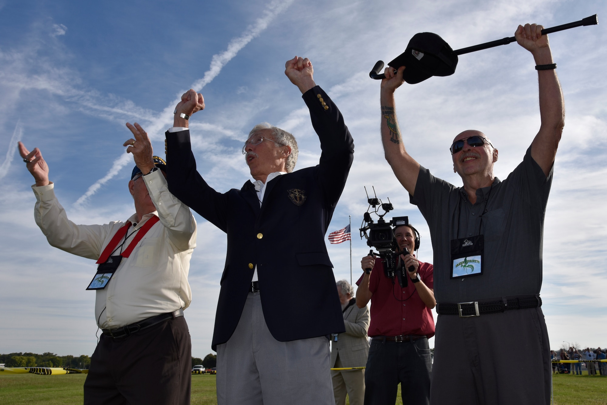 DAYTON, Ohio -- Veterans of the 20th Special Operations Squadron watch a CV-22 Osprey aircraft assigned to the 20th Special Operations Squadron at Cannon Air Force Base, N.M., perform a fly over for the public before the Green Hornet Dedication ceremony at the museum on Sept. 15, 2016. The museum formally dedicated an exhibit and diorama depicting their rescue mission in Vietnam on Nov. 26, 1968. (U.S. Air Force photo by Felita LaRock)
