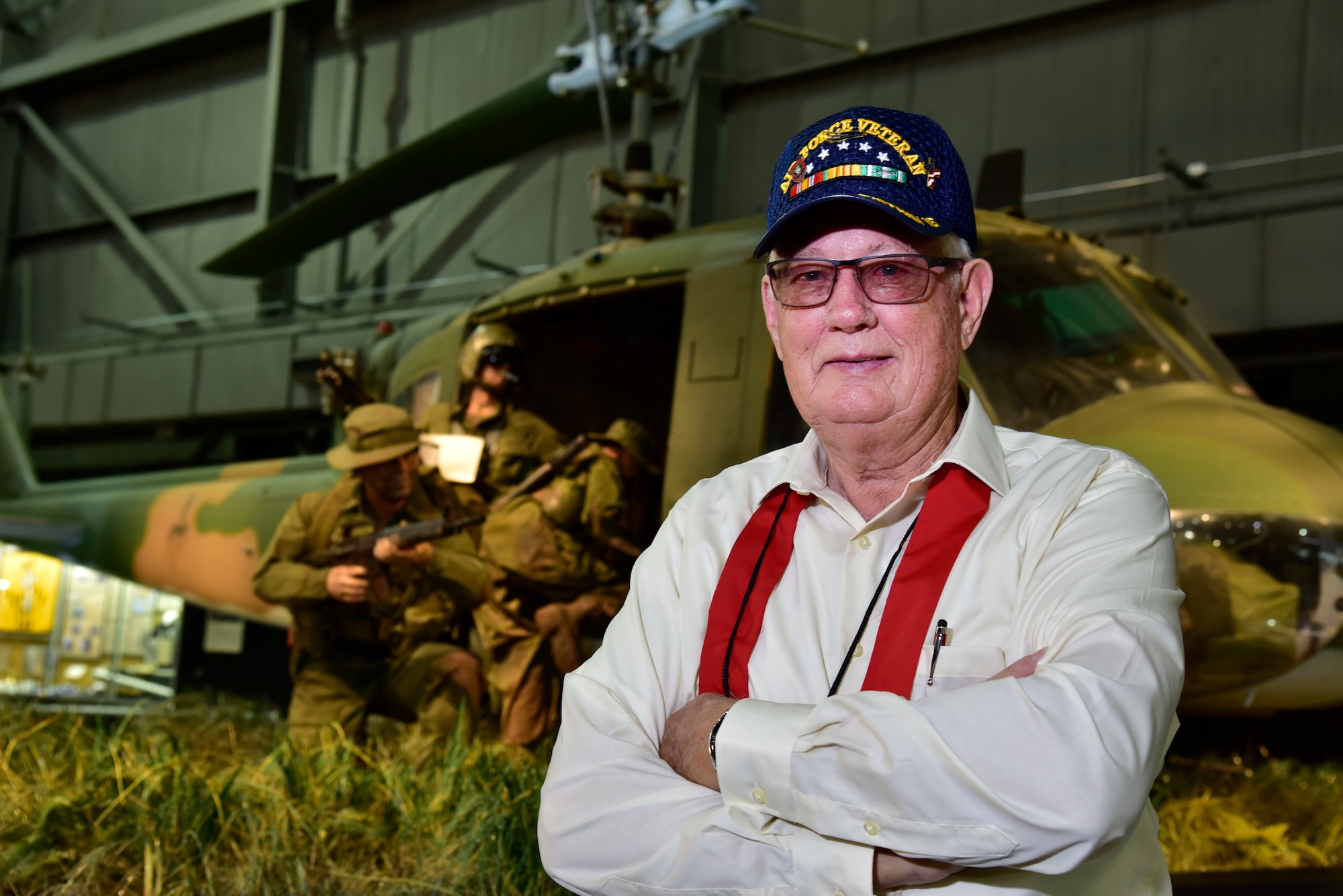 DAYTON, Ohio -- MSgt. (Ret.) Fred Cook stands in front of the Secret War diorama in the Southeast Asia War Gallery at the National Museum of the U.S. Air Force on Sept. 15, 2016. Cook served his second tour in Southeast Asia  with the 20th SOS "Green Hornets" at Nha Trang and Ban Me Thout, Vietnam. He was the right door gunner on the 26 Nov 1968 mission that is depicted in the National Museum of the U.S. Air Force’s UH-1P, 20th SOS “Green Hornets,” legacy diorama display. He was awarded the Distinguished Flying Cross for Valor for his part in this mission.(U.S. Air Force photo by Ken LaRock)
