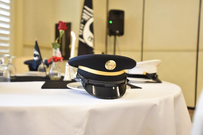 Service hats represent each branch of service on the POW/MIA table. Every year, members from Joint Base Charleston participate in a 24-hour vigil run, a luncheon to honor prisoners of war and those that are missing in action, as well as a formal retreat ceremony. 