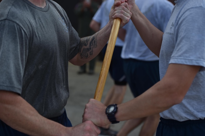 Tech. Sgt. David Hardy transfers the POW/MIA flag to Chief Master Sgt. Mark Cantrell September 16, 2016, at Joint Base Charleston, South Carolina. Every year, members from the base participate in a 24-hour vigil run, a luncheon to honor prisoners of war and those that are missing in action, as well as a formal retreat ceremony.