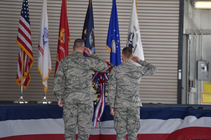 U.S. Air Force Col. Robert Lyman, Joint Base Charleston commander salutes a wreath as dedication to the prisoners of war and those missing in action at Nose Dock 2, September 16, 2016, at Joint Base Charleston, South Carolina. Every year, members from the base participate in a 24-hour vigil run, a luncheon to honor prisoners of war and those that are missing in action, as well as a formal retreat ceremony. 