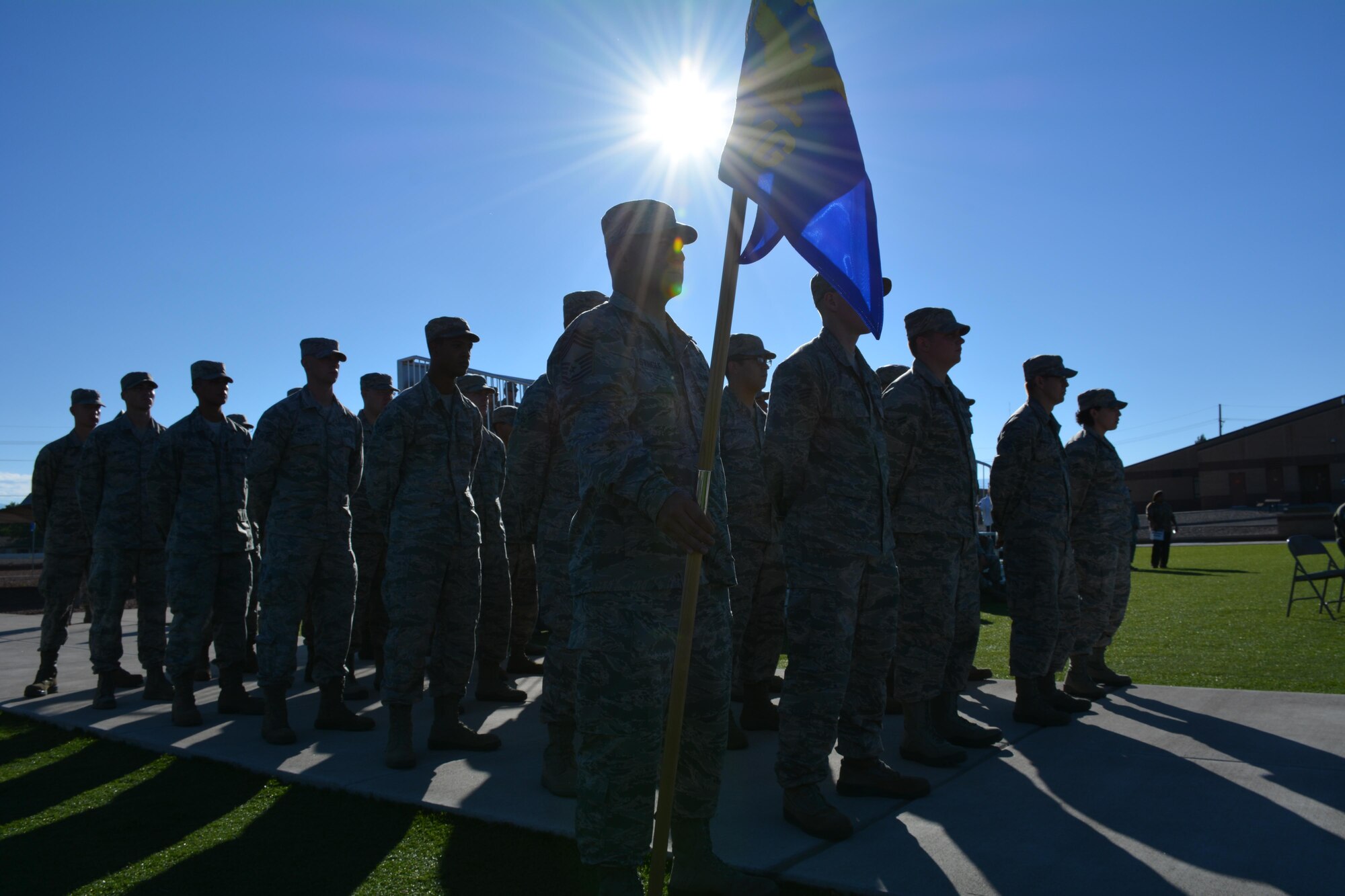 Members of the 49th Materiel Maintenance Group stand in formation at the POW/MIA remembrance ceremony at Holloman Air Force Base, N.M., on Sept. 16, 2016. The ceremony, which was in remembrance of prisoners of war and those still missing in action, was part of Holloman’s POW/MIA commemoration. (U.S. Air Force photo by Staff Sgt. Warren Spearman)