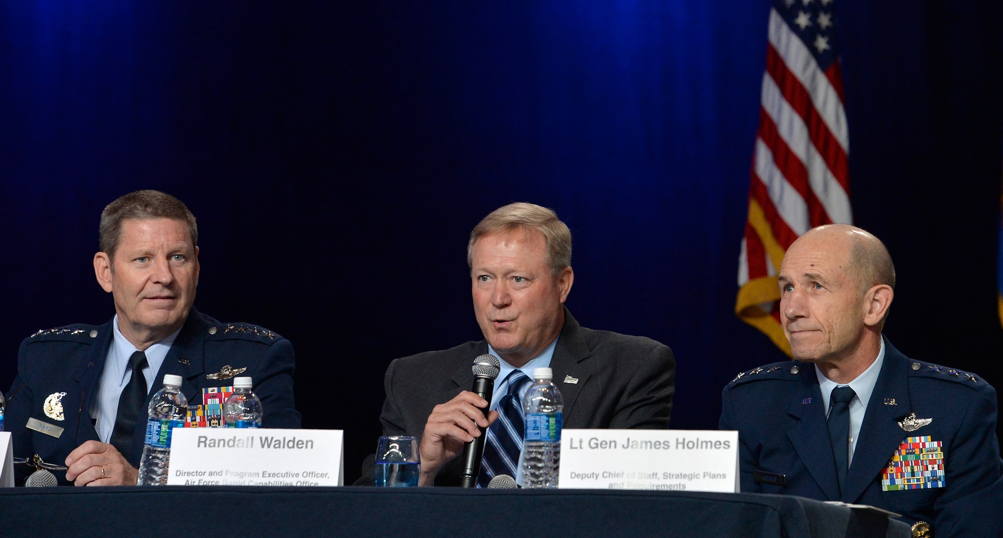 Randall G. Walden, the director and program executive officer of the Air Force Rapid Capabilities Office, answers a question during a B-21 panel at the Air Force Association's Air, Space and Cyber Conference in National Harbor, Md., Sept. 19, 2016. Gen. Robin Rand, the Air Force Global Strike Command commander,  and Lt. Gen. James Holmes, the deputy chief of staff, strategic plans and requirements, were also members of the panel. (U.S. Air Force photo/Staff Sgt. Whitney Stanfield)
