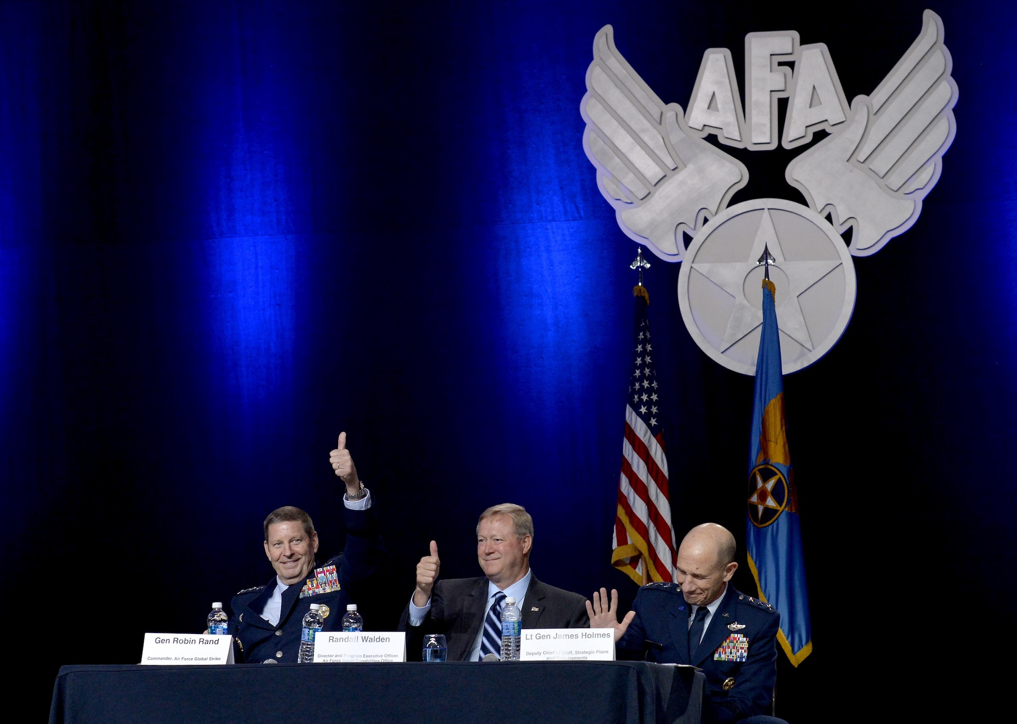 Gen. Robin Rand, the Air Force Global Strike Command commander, Randall G. Walden, the director and program executive officer of the Air Force Rapid Capabilities Office, and Lt. Gen. James Holmes, the deputy chief of staff, strategic plans and requirements, gives a thumbs-up to the B-21 bomber's new name during the Air Force Association's Air, Space and Cyber Conference in National Harbor, Md., Sept. 19, 2016. The B-21 will be known as the Raider. (U.S. Air Force photo/Staff Sgt. Whitney Stanfield)
