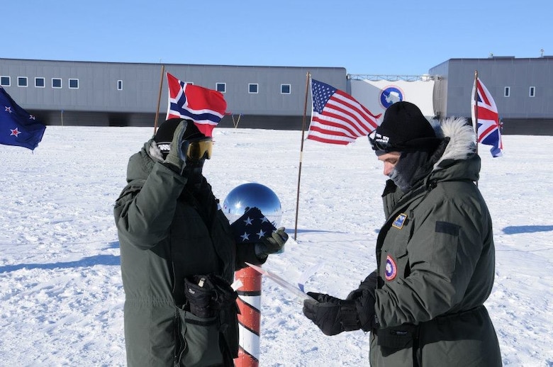 MCMURDO STATION, Antarctica – Maj. Dwayne Rolniak, right, presides over a re-enlistment ceremony for Tech. Sgt. Guillermo Mejia at the South Pole.  Mejia, who is originally from rural Quitandeje, Mexico, has visited many unique places across the globe in his Air Force career, including Antarctica. He is now with the 21st Aerospace Medicine Squadron at Peterson Air Force Base, Colo. (Courtesy photo)