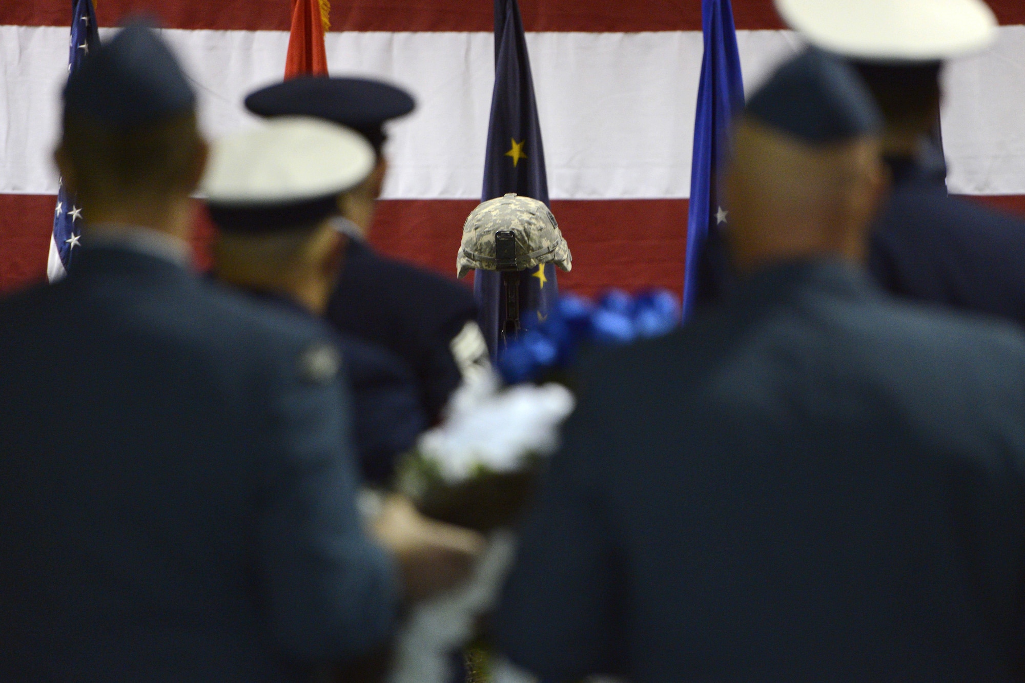 Service members line up to place wreaths during the POW/MIA ceremony at the Alaska National Guard Armory, Sept. 16, 2016. Alaska Gov. Bill Walker proclaimed Sept. 16 POW/MIA Recognition Day. “Alaskans are encouraged to honor, support, and remember those who were prisoners of war, those presently missing in action, and their loved ones, and I direct that all state agencies in possession of a POW/MIA flag shall fly [it],” the governor said. 