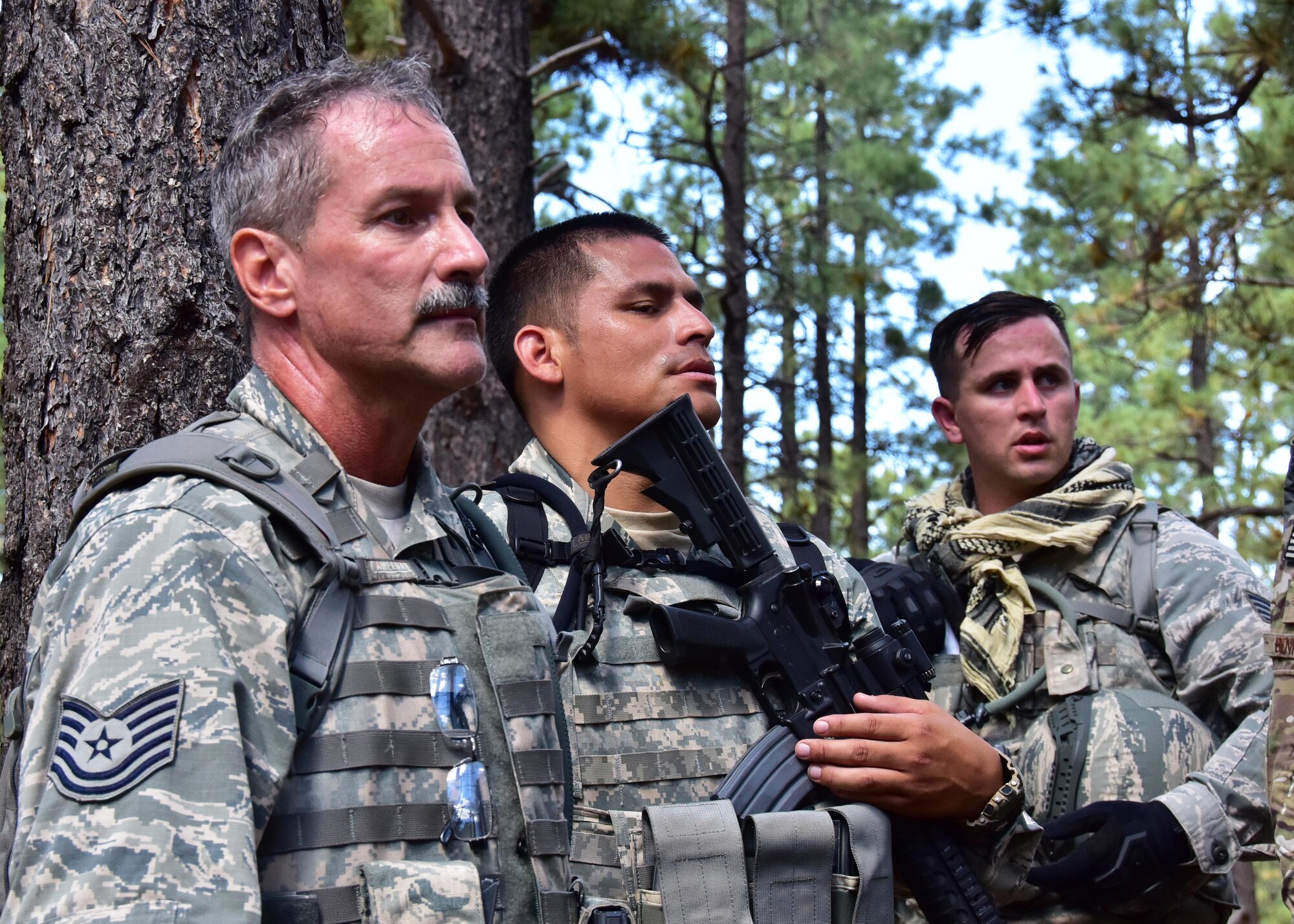 944th Security Forces Squadron fire team members rest and listen to instructions Sept. 9 during combat training at Camp Navajo, Arizona Army National Guard facility in Bellemont Arizona. (U.S. Air Force photo by Tech. Sgt. Barbara Plante)