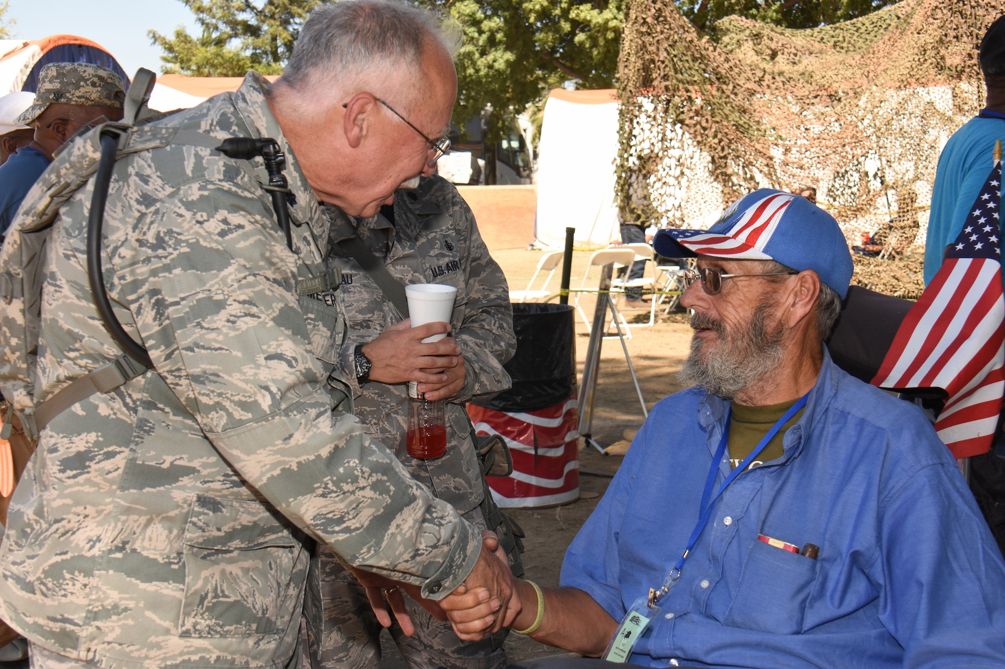 Lt. Col. Brad Meyers, physician for the Wisconsin Air National Guard's 115th Fighter Wing engages participants of the 2016 East Bay Stand Down Innovative Readiness Training exercise Sept. 16, 2016. The four day event allowed Guard and Reserve members from four service branches to meet critical training requirements while providing medical, dental and optometry care to the medically underserved, homeless veteran community of California's East Bay Region. (Air National Guard photo by Master Sgt. Paul Gorman/Released) 