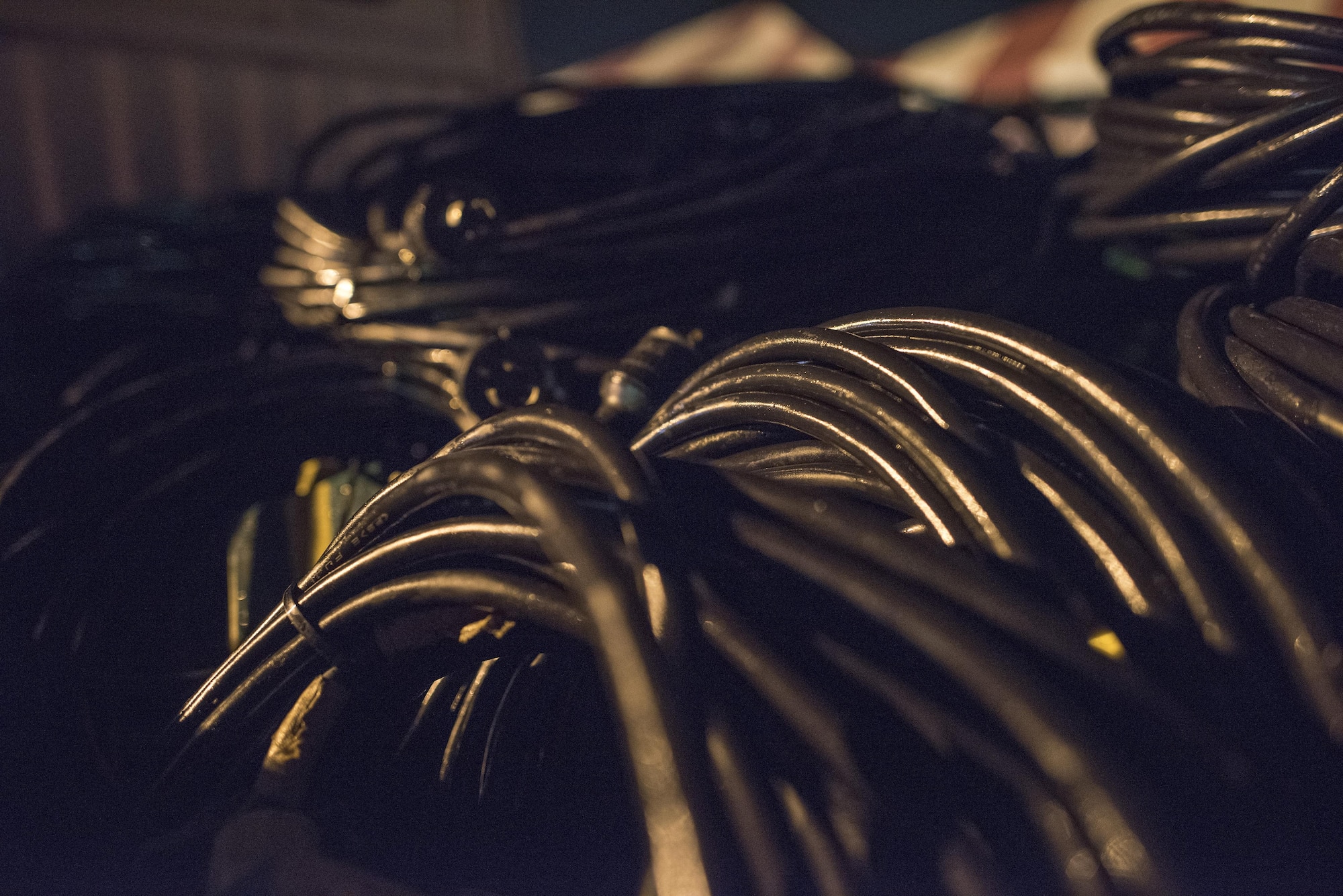 Coils of power cords sit in the back up a truck after the 2016 Japanese-American Friendship Festival at Yokota Air Base, Japan, Sept. 18, 2016. After the festival, Twelve Airmen with the 374th Civil Engineer Squadron electrician shop rolled thousands of feet of power cords lining the festival grounds, assisting to return the flightline to full operational status by early morning. (U.S. Air Force photo by Staff Sgt. Cody H. Ramirez/Released)