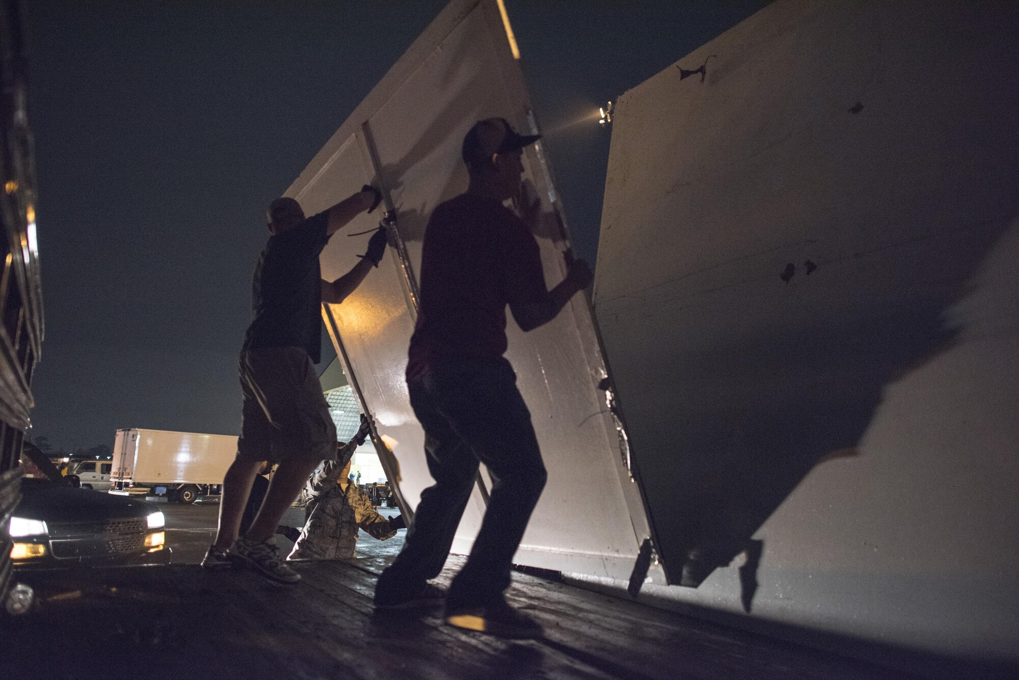 Airmen with the 374th Civil Engineer Squadron structures shop load parts of a booth ceiling onto a truck after the 2016 Japanese-American Friendship Festival at Yokota Air Base, Japan, Sept. 18, 2016. At the conclusion of the festival, Airmen worked to breakdown booths, remove wiring and barriers and clean the grounds. (U.S. Air Force photo by Staff Sgt. Cody H. Ramirez/Released)