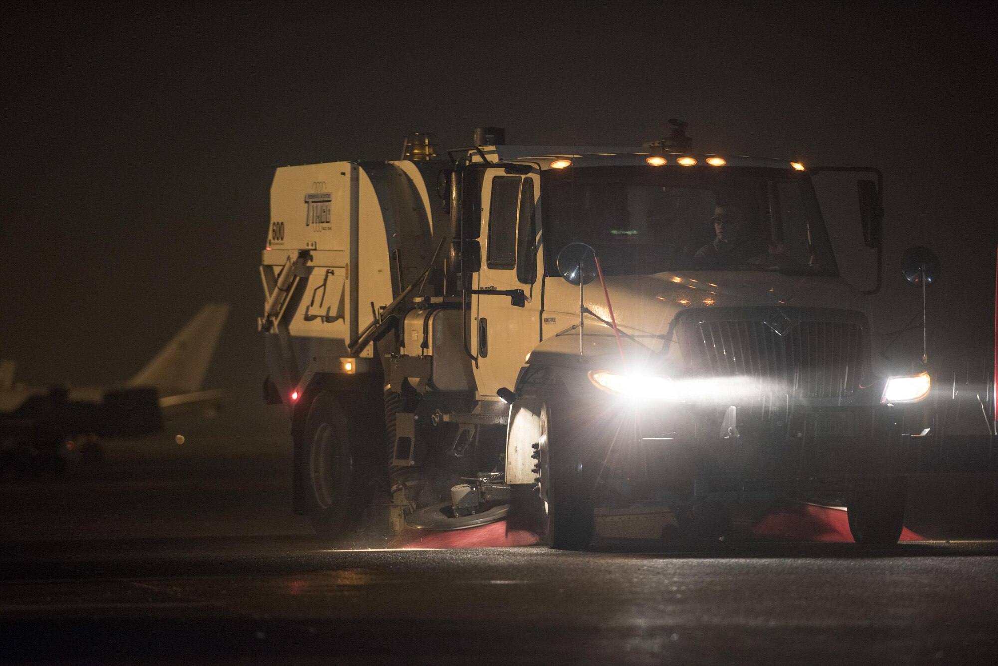 A street sweeper vehicle cleans the flightline after the 2016 Japanese-American Friendship Festival at Yokota Air Base, Japan, Sept. 18, 2016. The festival grounds are located on part of Yokota’s flightline, requiring pick up and cleaning before returning to a fully operational status. (U.S. Air Force photo by Staff Sgt. Cody H. Ramirez/Released)