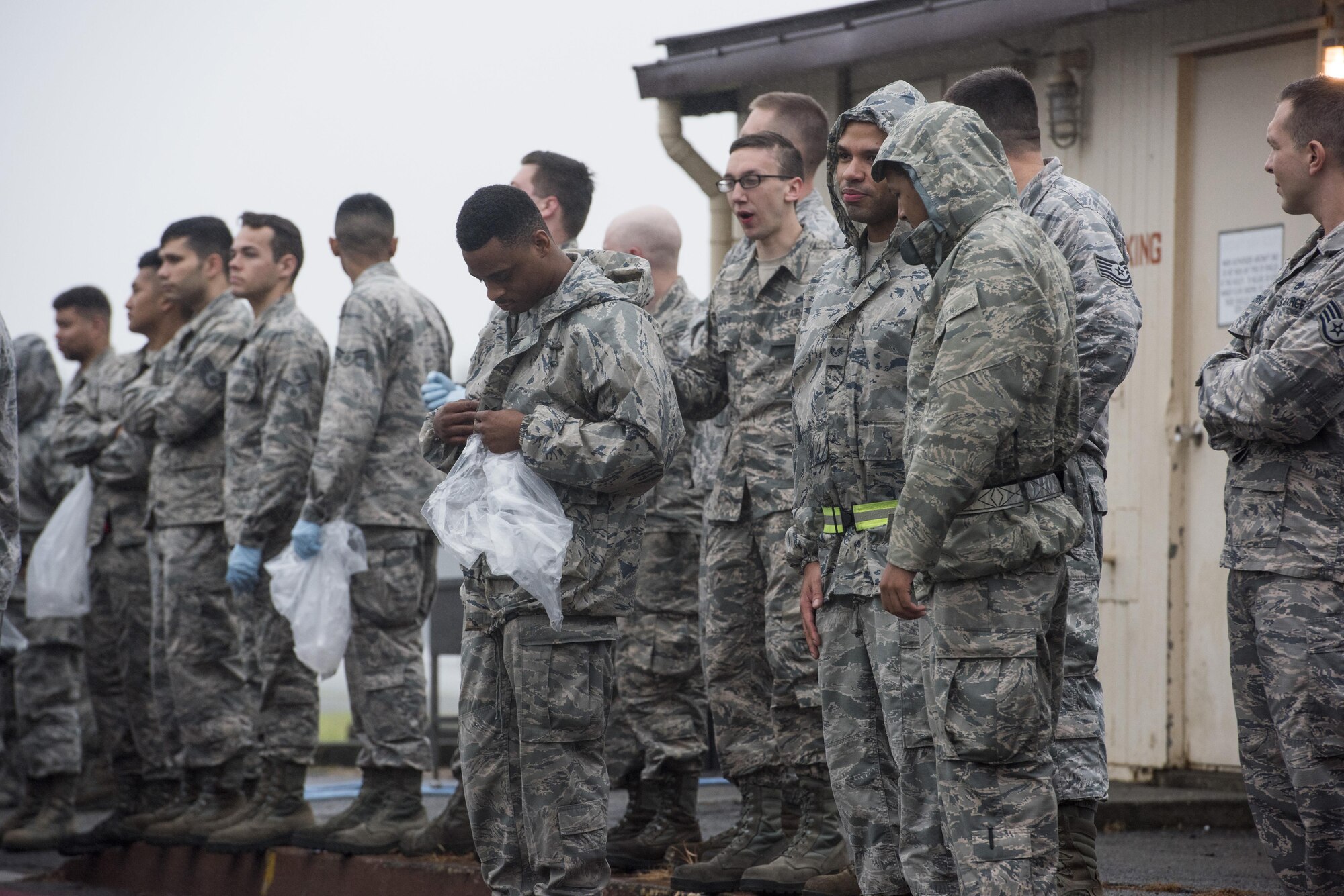 Airmen with the 374th Aircraft Maintenance Squadron and 374th Maintenance Squadron gather to begin a foreign-debris walk at Yokota Air Base, Japan, Sept. 19, 2016. Airmen with the 374th Airlift Wing walked sections of Yokota the morning following the 2016 Japanese-American Friendship Festival to pick up left over debris and return the flightline to fully operational status. (U.S. Air Force photo by Staff Sgt. Cody H. Ramirez/Released)