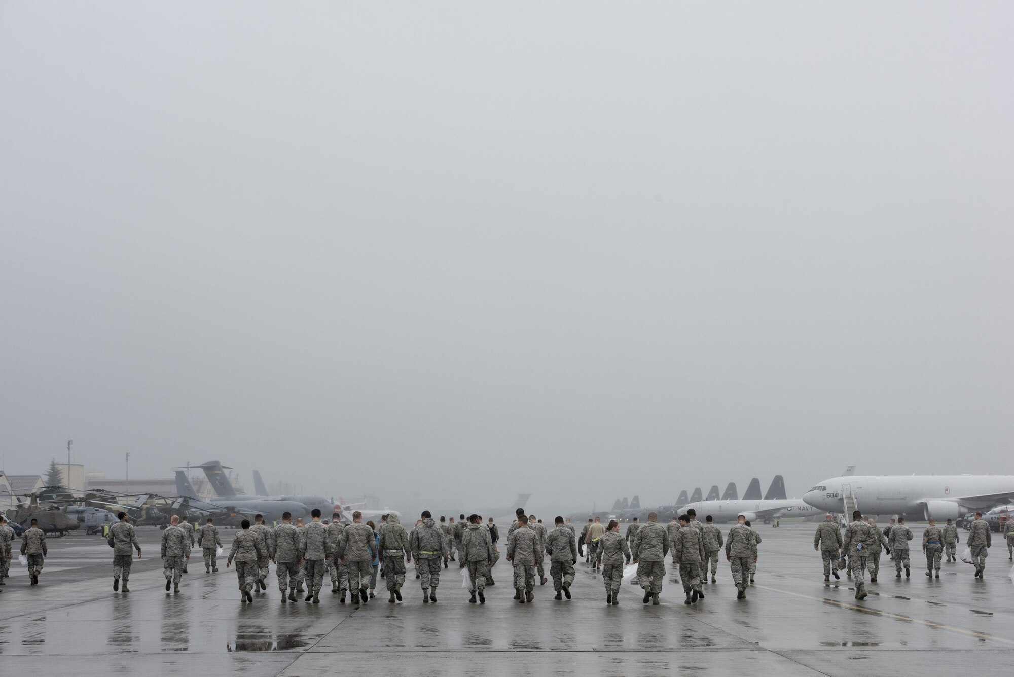 Airmen conduct a foreign-debris walk on the flightline at Yokota Air Base, Japan, Sept. 19, 2016. More than 135,000 people attended the 2016 Japanese-American Friendship Festival the two-days prior. (U.S. Air Force photo by Staff Sgt. Cody H. Ramirez/Released)