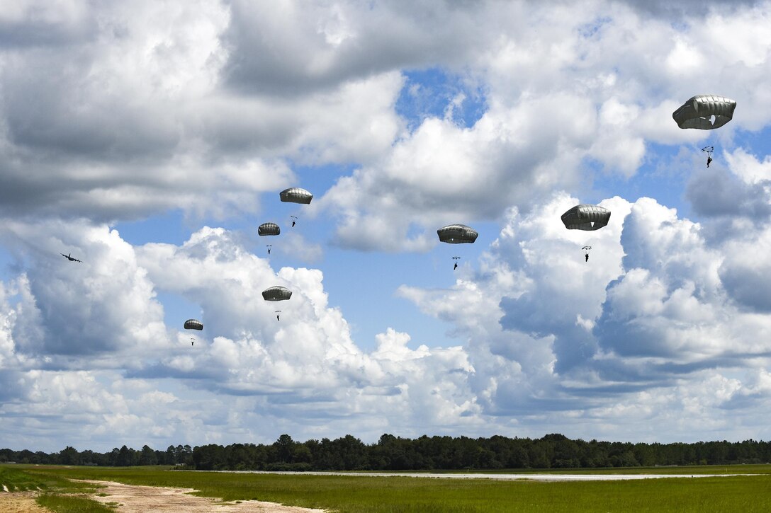 U.S. Air Force Airmen from the 823d Base Defense Squadron float during a static-line jump, Sept. 16, 2016, at the Lee Fulp drop zone in Tifton, Ga. During static-line jumps, Airmen attach their parachute’s ripcord to the aircraft, so that when they exit, the parachute opens automatically. (U.S. Air Force photo by Airman 1st Class Daniel Snider)