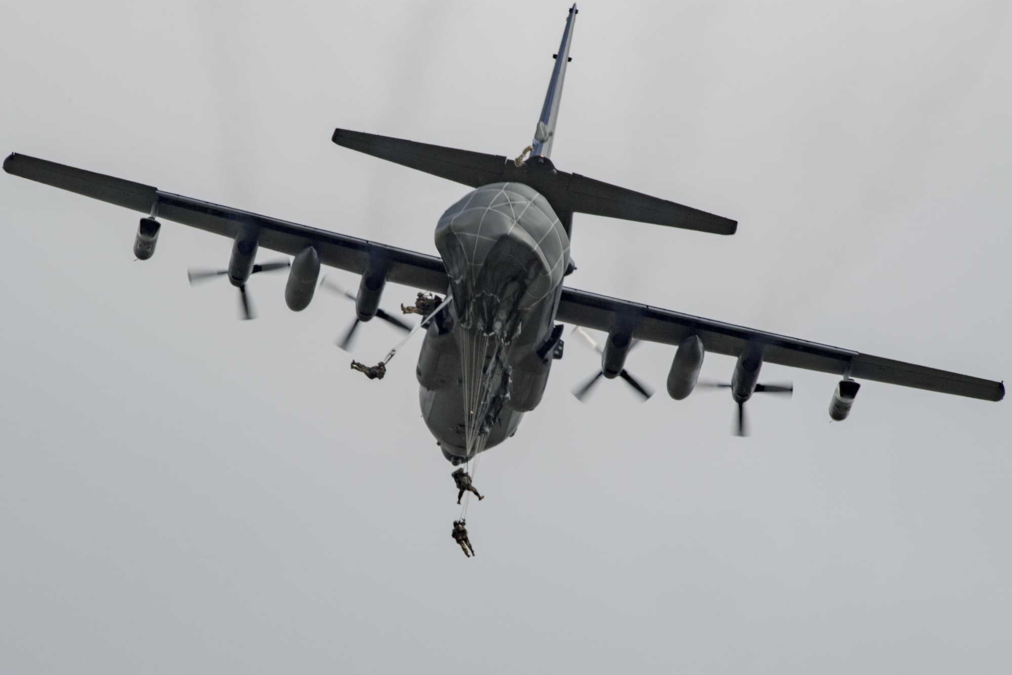 U.S. Air Force Airmen from the 823d Base Defense Squadron depart an MC-130H Combat Talon II during a static-line jump, Sept. 16, 2016, at the Lee Fulp drop zone in Tifton, Ga. The majority of the 823d is security forces members trained to deploy and protect. (U.S. Air Force photo by Airman 1st Class Daniel Snider)