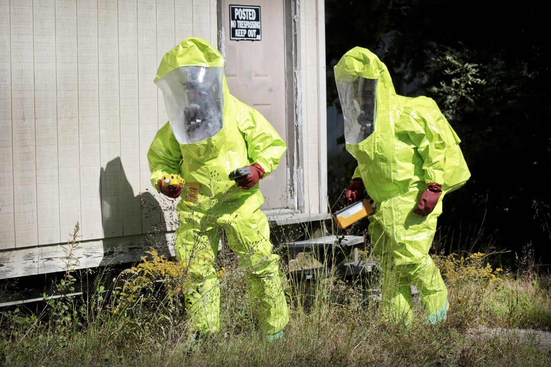 Air National Guard Staff Sgt. Seth Schoenfeld, left, and Senior Airman Stanley Tarasewicz search for contaminants in a simulated hot zone during Exercise Clean House at Joint Base McGuire-Dix-Lakehurst, N.J., Sept. 14, 2016. Schoenfeld and Tarasewicz are emergency management airmen assigned to the New Jersey National Guard’s 108th Civil Engineering Squadron. Air National Guard photo by Tech. Sgt. Matt Hecht