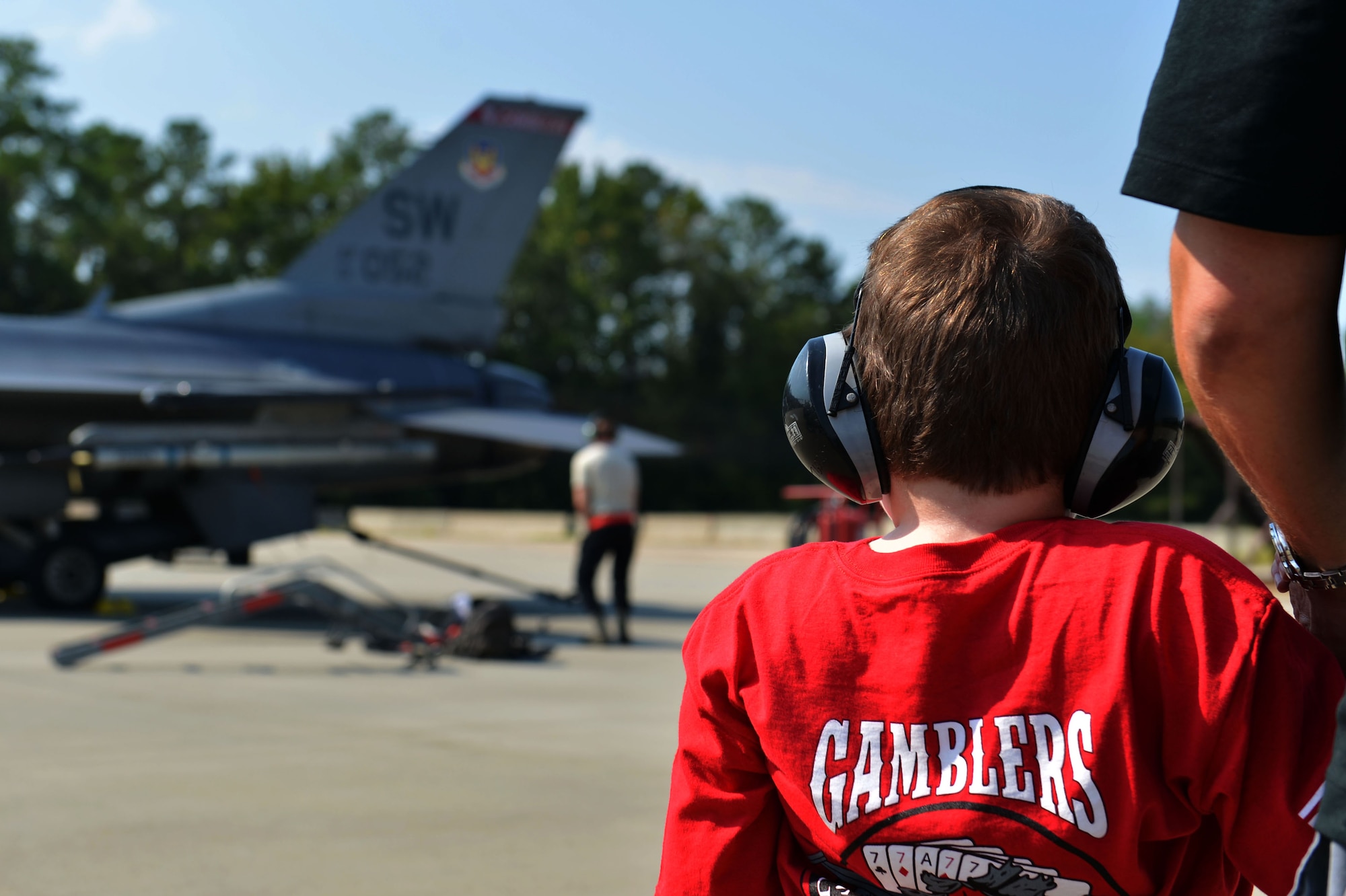 Jake Pritchard, 20th Security Forces Squadron honorary defender, watches as Airmen assigned to the 20th Aircraft Maintenance Squadron test the afterburner of an F-16CM Fighting Falcon at Shaw Air Force Base, S.C., Sept. 9, 2016. Pritchard visited the 20th AMXS afterburner test pad as part of a patrol on the flightline during a “Defender for a Day” event. (U.S. Air Force photo by Airman 1st Class Christopher Maldonado)