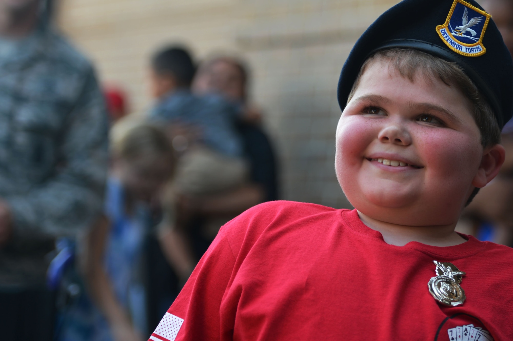 Jake Pritchard, 20th Security Forces Squadron honorary defender, smiles after receiving his SFS beret and badge during a “Defender for a Day” event at Shaw Air Force Base, S.C., Sept. 9, 2016. Throughout the duration of the event, Pritchard had the opportunity to watch military working dog demonstrations, observe military weapon static displays, and learn about apprehending a subject. (U.S. Air Force photo by Airman 1st Class Christopher Maldonado)