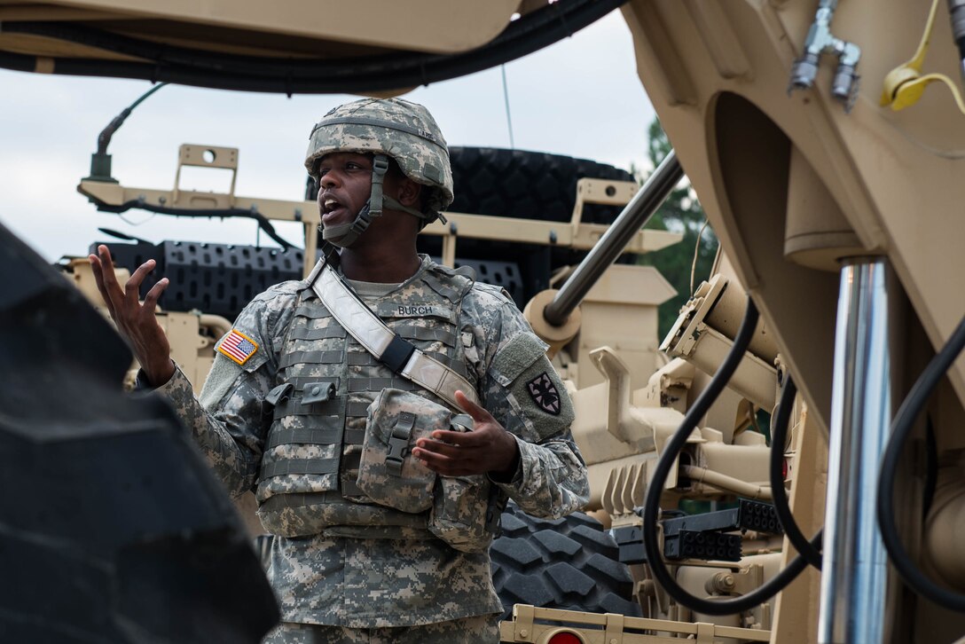 U.S. Army Pfc John Burch, 56th Transportation Battalion 567th Inland Cargo Transportation Company cargo specialist, directs a 10K forklift driver into position during training at Joint Base Langley-Eustis, Va., Sept. 8, 2016. Cargo specialists are responsible for transferring or supervising the transfer of passengers, cargo and equipment to and from air, land and water transports. (U.S. Air Force photo by Airman 1st Class Derek Seifert)