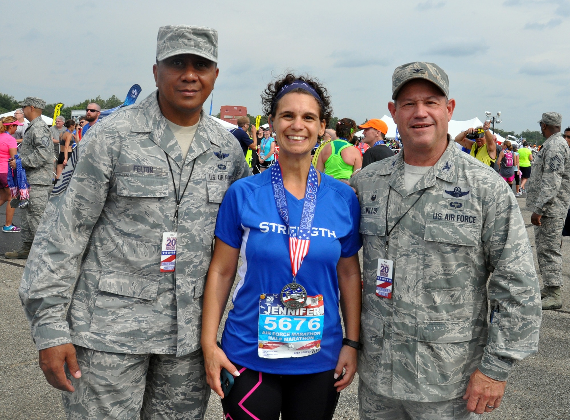 Master Sgt. Jennifer Hess, 445th Civil Engineer Squadron first sergeant, poses with Chief Master Sgt. James Felton, 445th Airlift Wing command chief, and Col. Adam Willis, 445th Airlift Wing commander, after completing the Air Force Marathon half marathon. (U.S. Air Force photo/Lt. Col. Cynthia Harris)