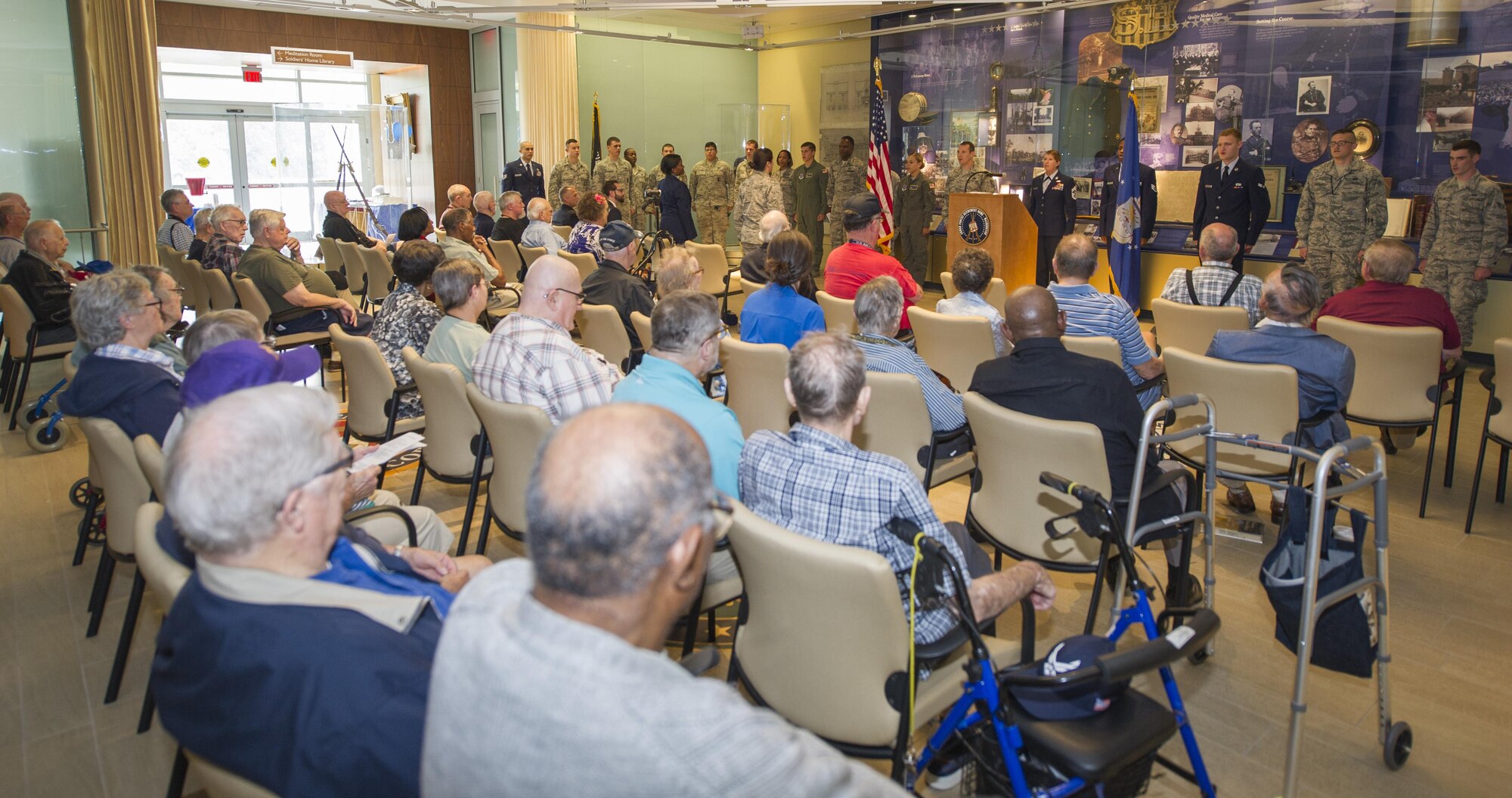 Joint Base Andrews Airmen stand and recite the Air Force song during the 69th Air Force Birthday Celebration at the Armed Forces Retirement Home in Washington, D.C., Sep. 16, 2016. After the event, Airmen got the chance to speak with retirees and share stories.