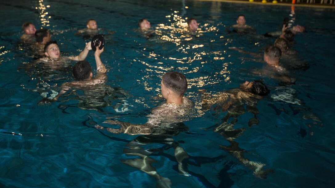 U.S. Marines with 1st Battalion, 1st Marine Regiment, Marine Rotational Force - Darwin, and Australian soldiers with 5th Battalion, Royal Australian Regiment, tread water with weights during the Frontline Leaders Course at Robertson Barracks, Northern Territory, Australia, Sept. 10, 2016. The course is intended to be an addition to the Marine Corps Lance Corporal’s Seminar, Corporal's Course, and Sergeant's Course. The course instills knowledge and leadership skills to positively impact those under their charge and the future of the Marine Corps. 1st Battalion, 1st Marine Regiment, created the course and this will be the first time the course has been officially conducted.