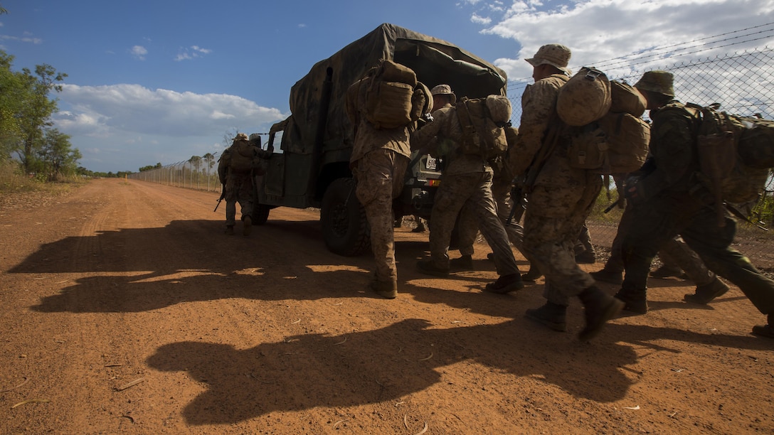 U.S. Marines with 1st Battalion, 1st Marine Regiment, Marine Rotational Force - Darwin, and Australian soldiers with 5th Battalion, Royal Australian Regiment, push a vehicle during the Frontline Leaders Course at Robertson Barracks, Northern Territory, Australia, Sept. 9, 2016. The course is intended to be an addition to the Marine Corps Lance Corporal’s Seminar, Corporal's Course, and Sergeant's Course. The course instills knowledge and leadership skills to positively impact those under their charge and the future of the Marine Corps. 1st Battalion, 1st Marine Regiment, created the course and this will be the first time the course has been officially conducted.