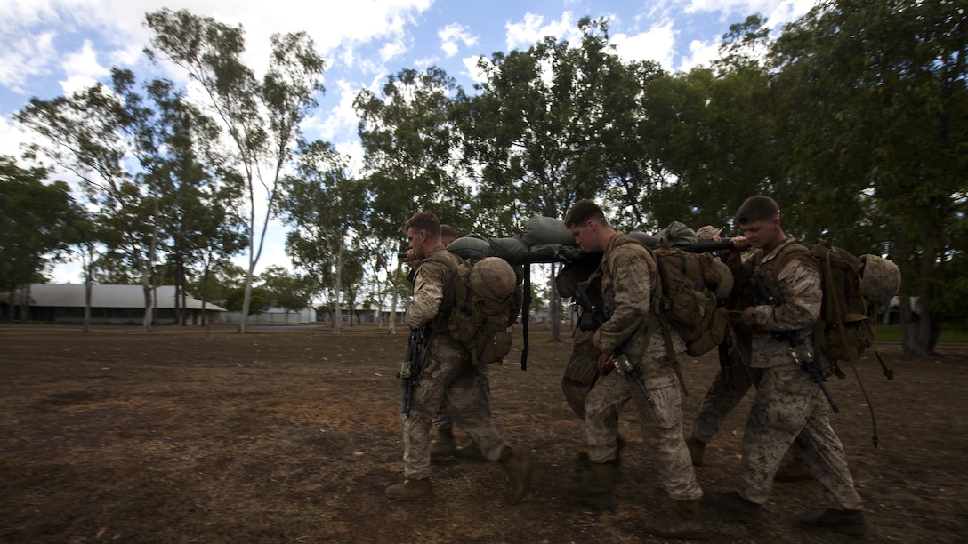 U.S. Marines with 1st Battalion, 1st Marine Regiment, Marine Rotational Force - Darwin, and Australian soldiers with 5th Battalion, Royal Australian Regiment, conduct a casualty evacuation drill during the Frontline Leaders Course at Robertson Barracks, Northern Territory, Australia, Sept. 10, 2016. The course is intended to be an addition to the Marine Corps Lance Corporal’s Seminar, Corporal's Course, and Sergeant's Course. The course instills knowledge and leadership skills to positively impact those under their charge and the future of the Marine Corps. 1st Battalion, 1st Marine Regiment, created the course and this will be the first time the course has been officially conducted.