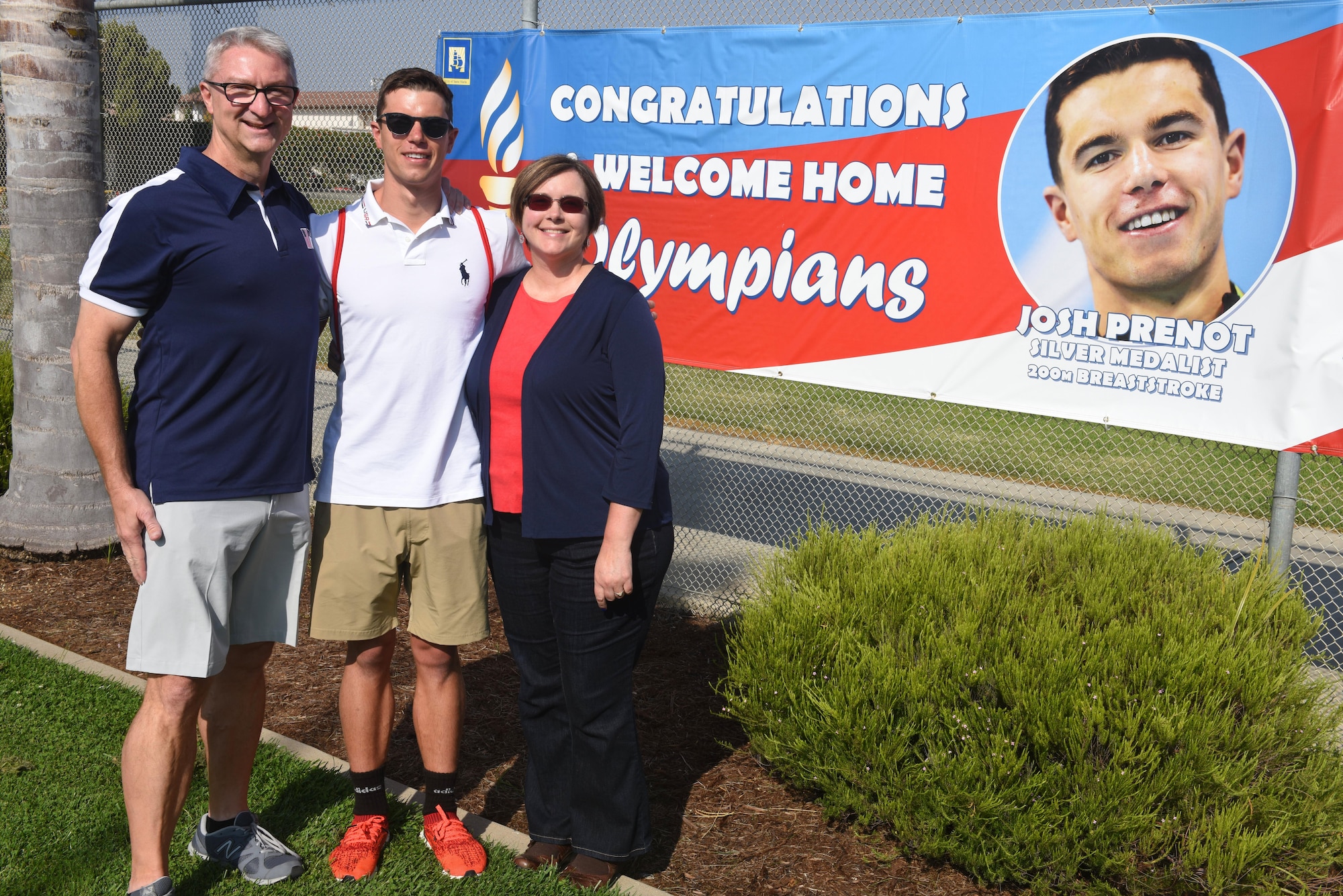 Bill Prenot, 30th Space Wing director of plans and programs, Josh Prenot, University of California Berkeley Physics major and swimmer, and Tammy Prenot, Josh’s mother, pose for a photo at the Santa Maria Swim Club, Sept. 9, 2016, Santa Maria, Calif. Josh recently returned home to Santa Maria for the first time since his silver medal performance in the 2016 Rio de Janeiro Olympic Games. (U.S. Air Force photo by Airman 1st Class Robert J. Volio/Released)