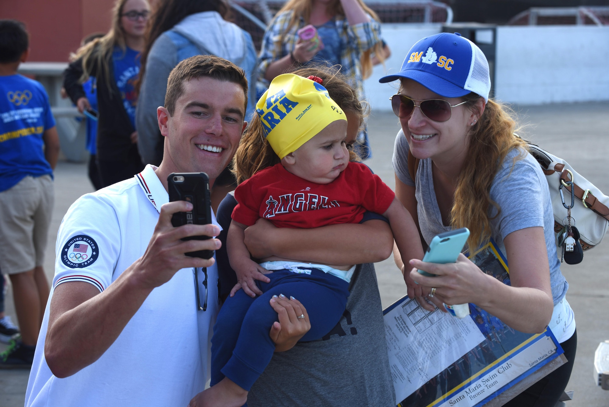 Josh Prenot, University of California Berkeley Physics major and swimmer, takes a photo with fans at the Santa Maria Swim Club, Sept. 9, 2016, Santa Maria, Calif. Josh recently returned home to Santa Maria for the first time since his silver medal performance in the 2016 Rio de Janeiro Olympic Games. (U.S. Air Force photo by Airman 1st Class Robert J. Volio/Released)
