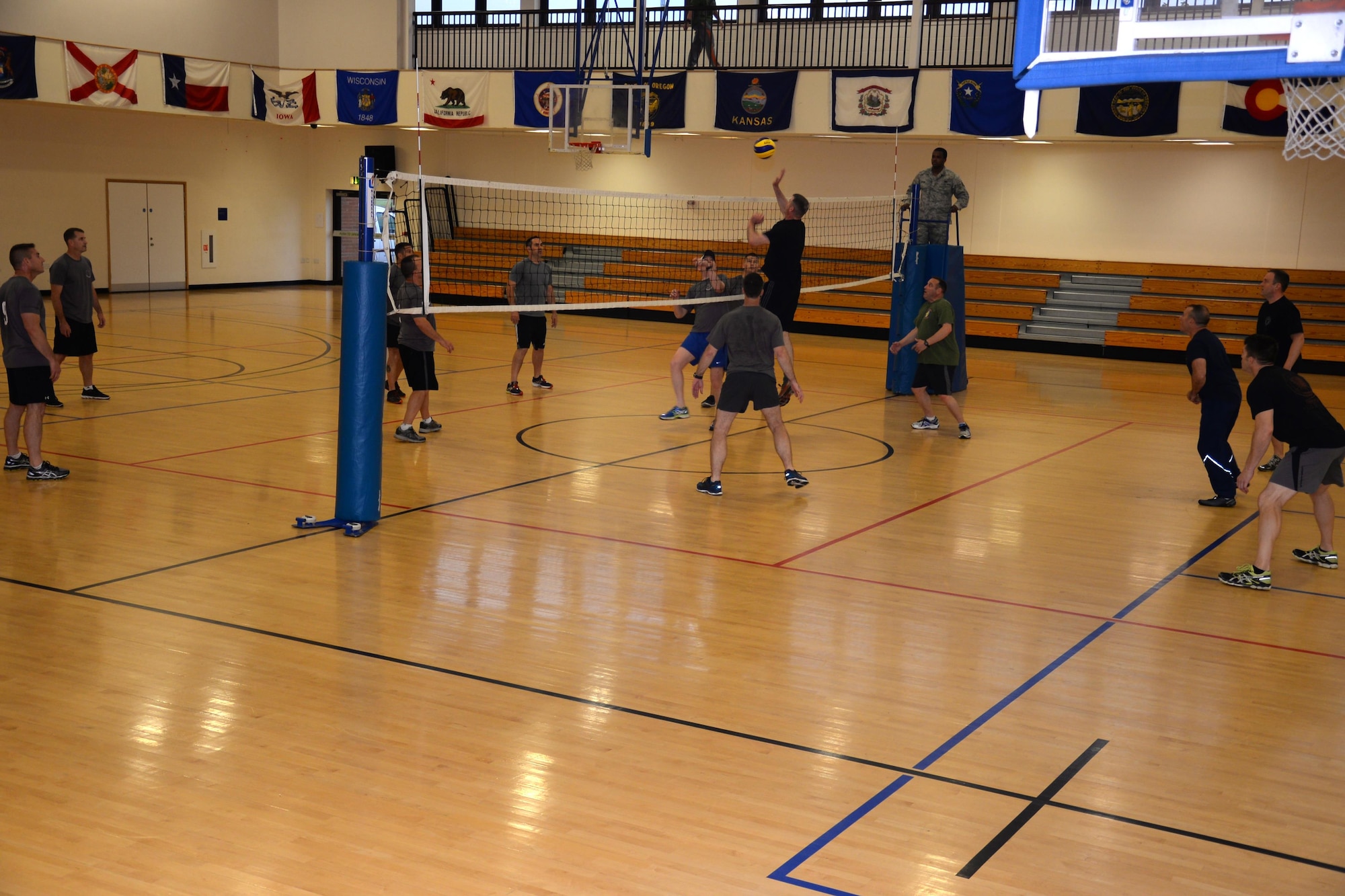 U.S. Air Force chief master sergeants and colonels battle it out on the court during a “Chiefs vs. Eagles” volleyball game Sept. 16, 2016, on RAF Mildenhall, England. Team Mildenhall leaders take part in quarterly events to build comradery amongst the chief master sergeants and the colonels. (U.S. Air Force photo by Gina Randall)