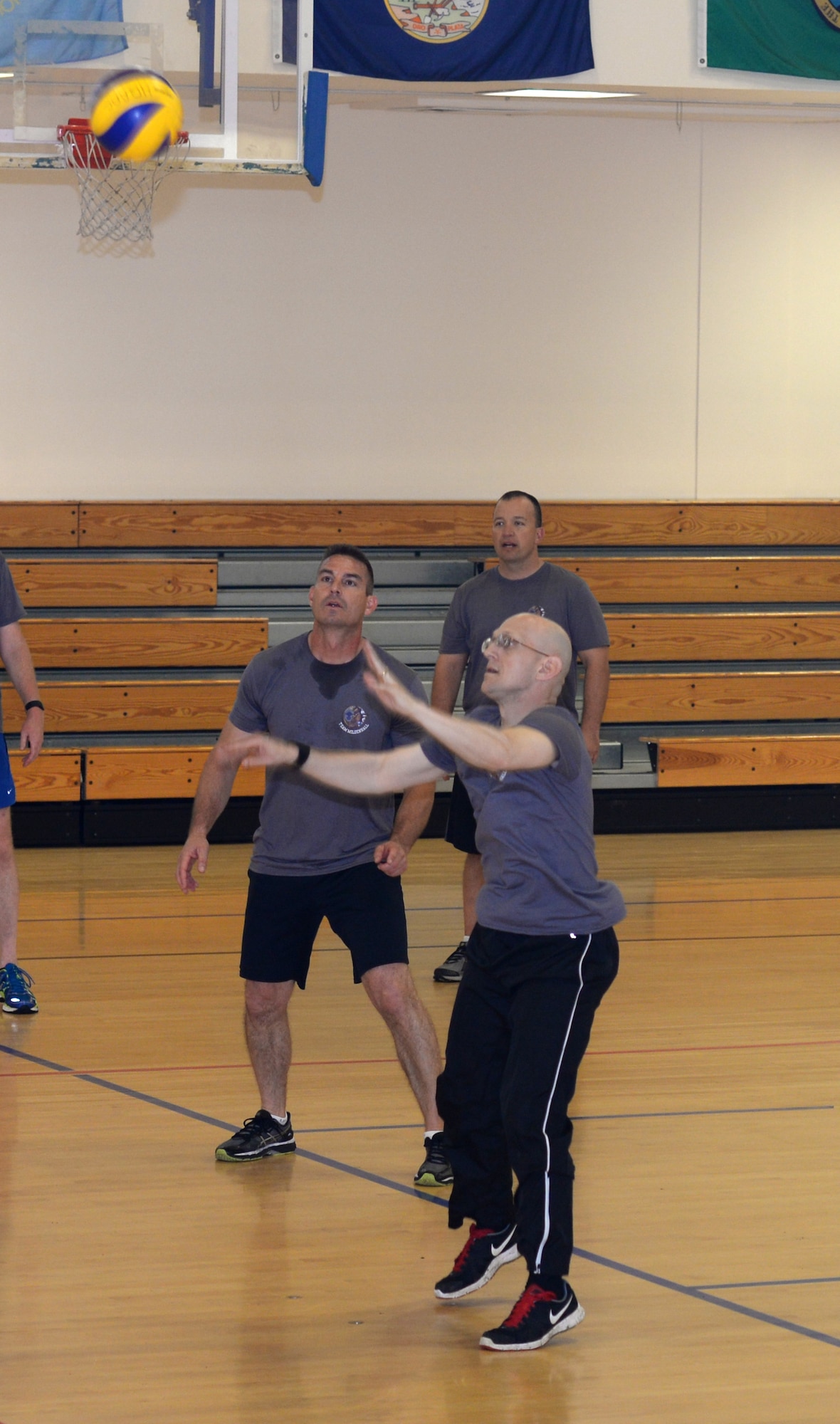 U.S. Air Force chief master sergeants and colonels battle it out on the volleyball court in the “Chiefs vs. Eagles” game Sept. 16, 2016, on RAF Mildenhall, England. Team Mildenhall leaders take part in these quarterly events to build comradery. (U.S. Air Force photo by Gina Randall)
