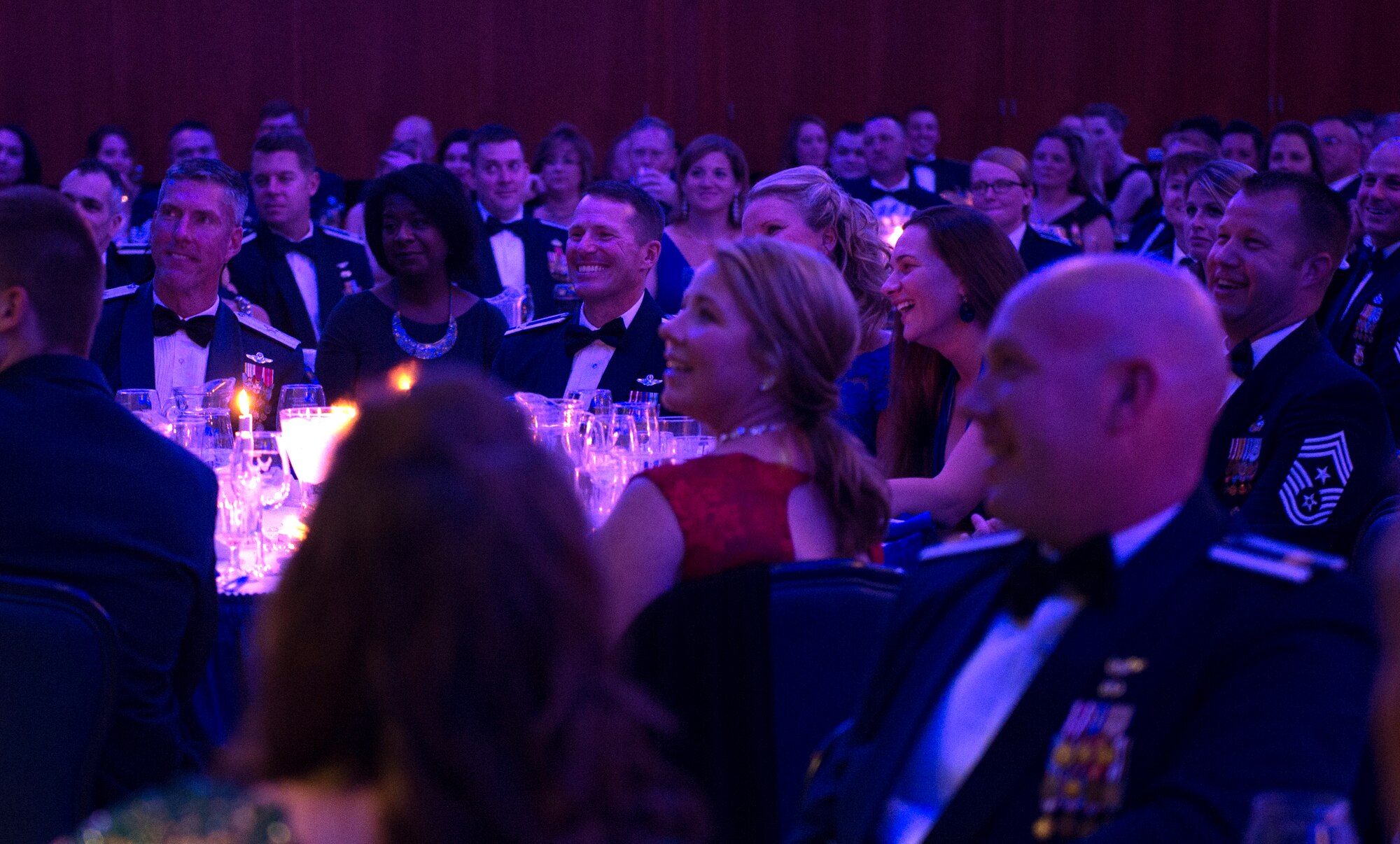 Saber ballroom guests enjoy remarks during the Air Force Ball at Club Eifel on Spagdahlem Air Base, Germany, Sept. 17, 2016. Col. Joseph McFall, 52nd Fighter Wing commander, made closing statements to more than 300 members in attendance at the annual event commemorating the Air Force’s birthday. The celebration included the Singing Sabers, a guest speaker, a three course formal dinner and dancing. (U.S. Air Force photo by Airman 1st Class Preston Cherry/Released)