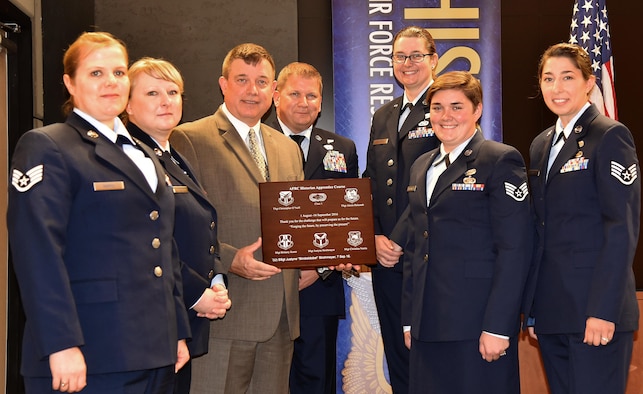 Dr. James Malachowski, Director of Historical Services, Headquarters Air Force Reserve Command, graduates the first class of the AFRC Historian Apprentice Course at Robins Air Force Base, Georgia, Sept. 16, 2016.  The students graduating are Staff Sgt. Brittany Kunz, Staff Sgt. Justyne Strohmeyer, Staff Sgt. Christina Norris, Technical Sgt. Christopher O'Neill and Tech Sgt. Alexis Holcomb.
