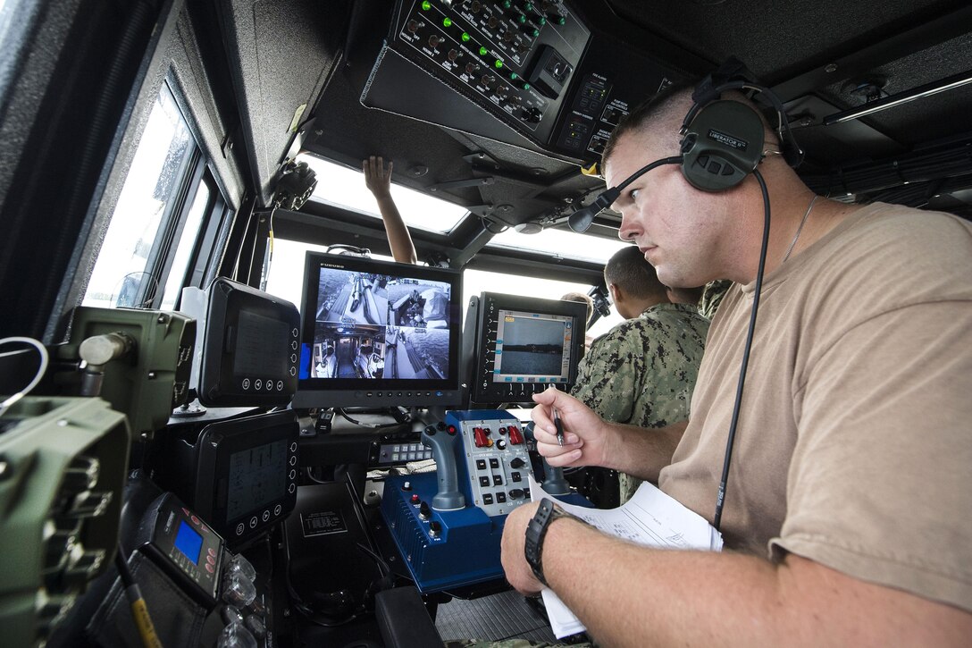 Navy Petty Officer 1st Class Francis Paulsen monitors engine revolutions on a Mark VI patrol boat while underway for expeditionary mine counter measures during Valiant Shield 2016 in Santa Rita, Guam, Sept. 14, 2016. Paulsen is an engineman assigned to Coastal Riverine Squadron 2. Navy photo by Petty Officer 1st Class Arthurgwain L. Marquez