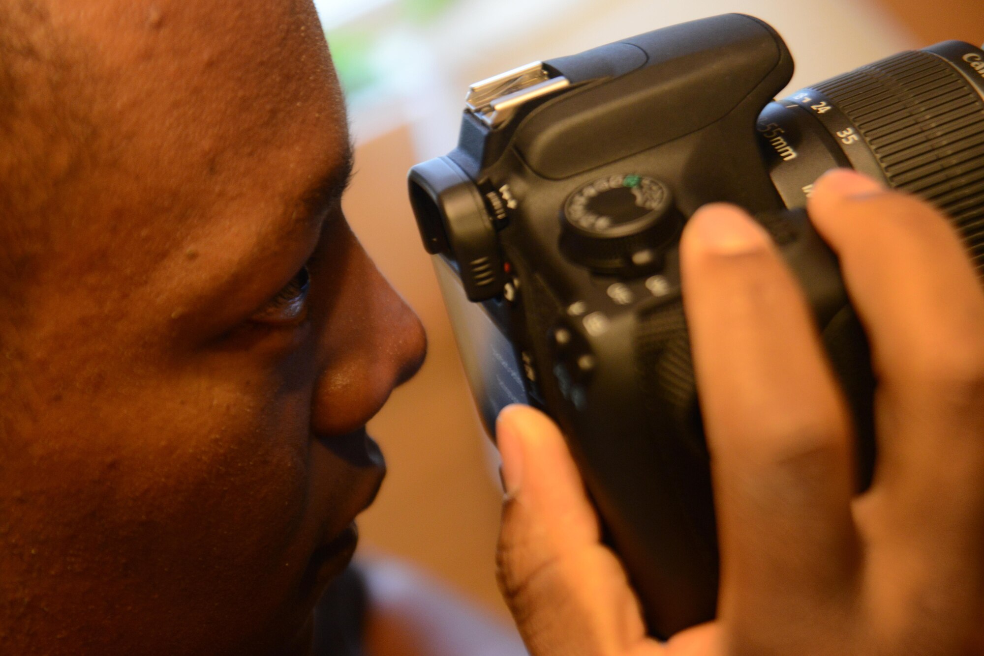 Airman 1st Class Matthew Simmons, 3rd Maintenance Squadron aircrew egress systems journeyman, adjusts his camera before recording his semiweekly videos at Joint Base Elmendorf-Richardson, Alaska, Sept. 15, 2016. Simmons is a Youtuber by the name ‘WildBlueYonder,’ and has created almost 200 videos talking about the Air Force and his experiences. He started out with a point-and-shoot camera and speaking his mind, now he has an arsenal of recording equipment including a drone and GoPro.