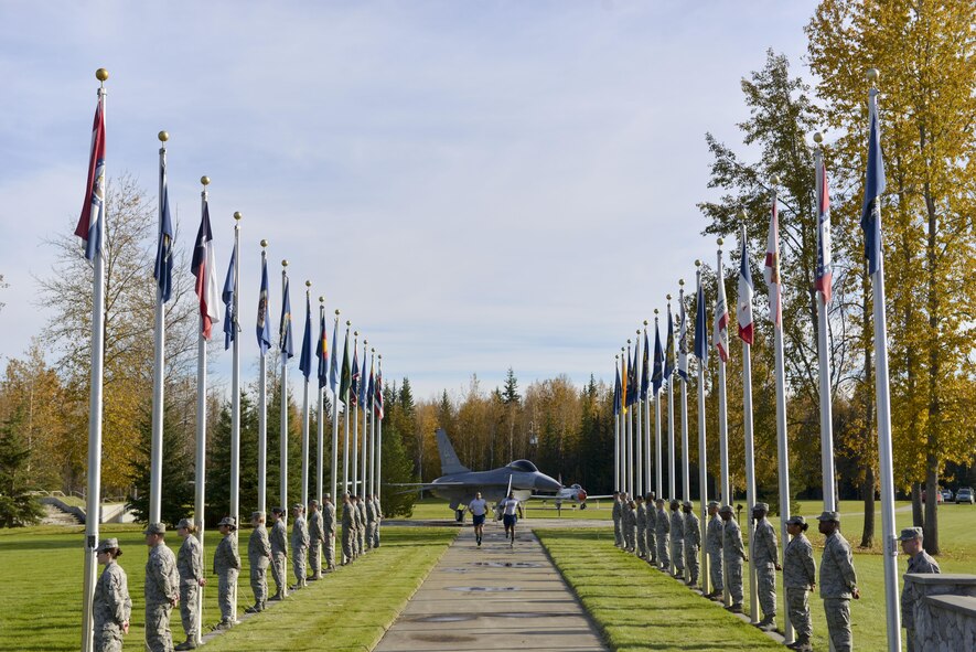 U.S. Air Force Airmen assigned to the 354th Fighter Wing finish the last leg of a run held in observance of POW/MIA Recognition Day, Sept. 16, 2016, at Heritage Park on Eielson Air Force Base, Alaska. Members of the Iceman team ran in 30 minute intervals for a total of 24 hours. (U.S. Air Force photo by Airman Isaac Johnson)