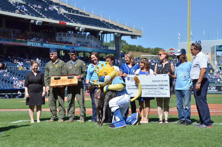 Local military organization representatives from the 442nd Fighter Wing, Missouri USO from Ft. Leonard Wood and Folds of Honor gather on the Kauffman Stadium baseball field in Kansas City, Mo., Sept. 19, 2016. Earlier this year, Diamond of Dreams, Royals Charities on-field gala, raised $350,000 to support local military organizations including active-duty, reserve and guard service members and their families. (U.S. Air Force photo/Senior Airman Missy Sterling)